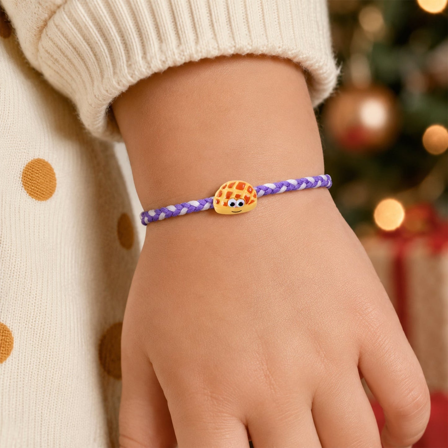 Rakhi tied with braided thread and smiley charm