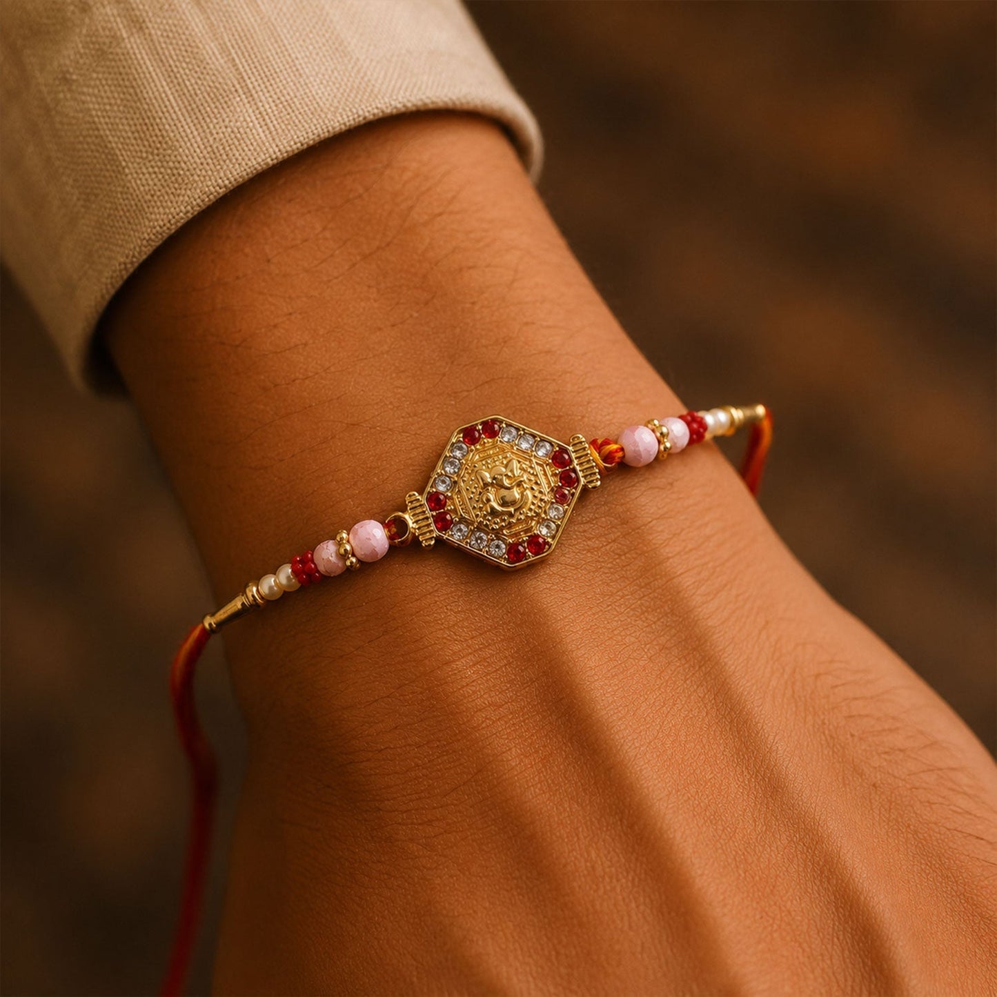 Closeup of Ganesh design on hexagon stone charm rakhi, detail shot