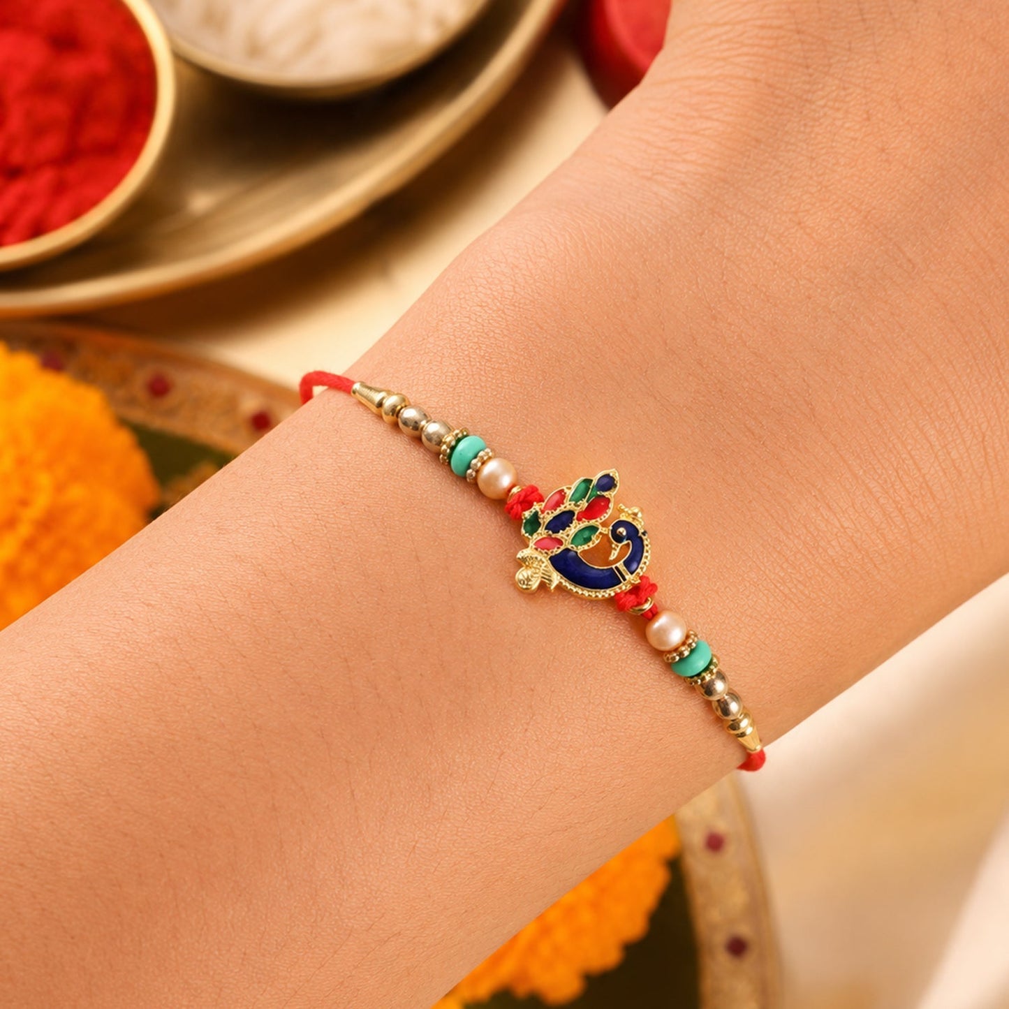 Close-up of designer meenakari peacock Rakhi with colorful beads