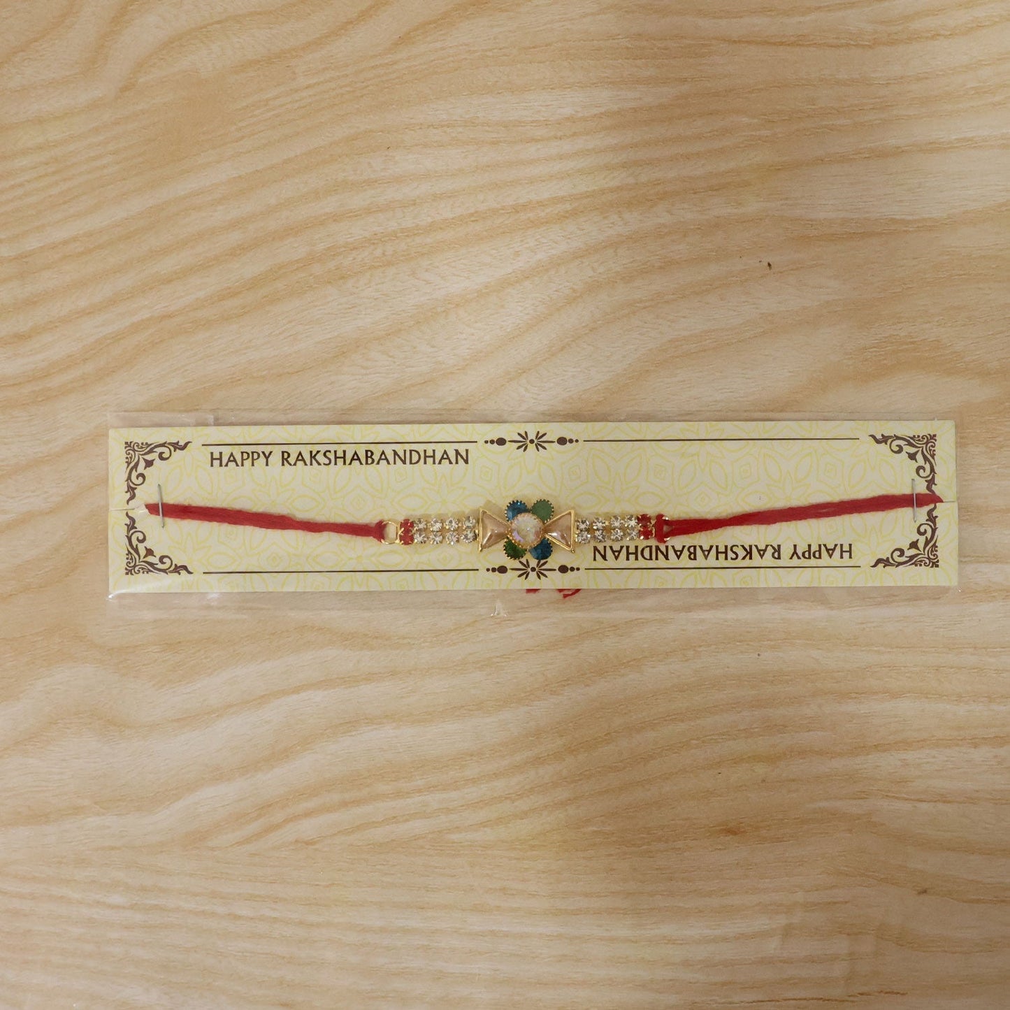 Festive crystal stone rakhi with vibrant design and colorful stones