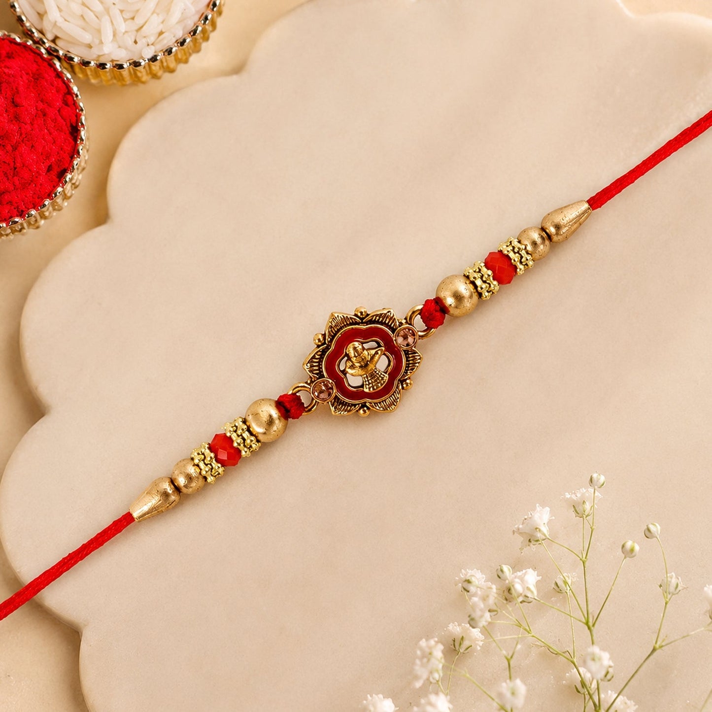 Top view of elegant Antique Shivling floral beaded Rakhi