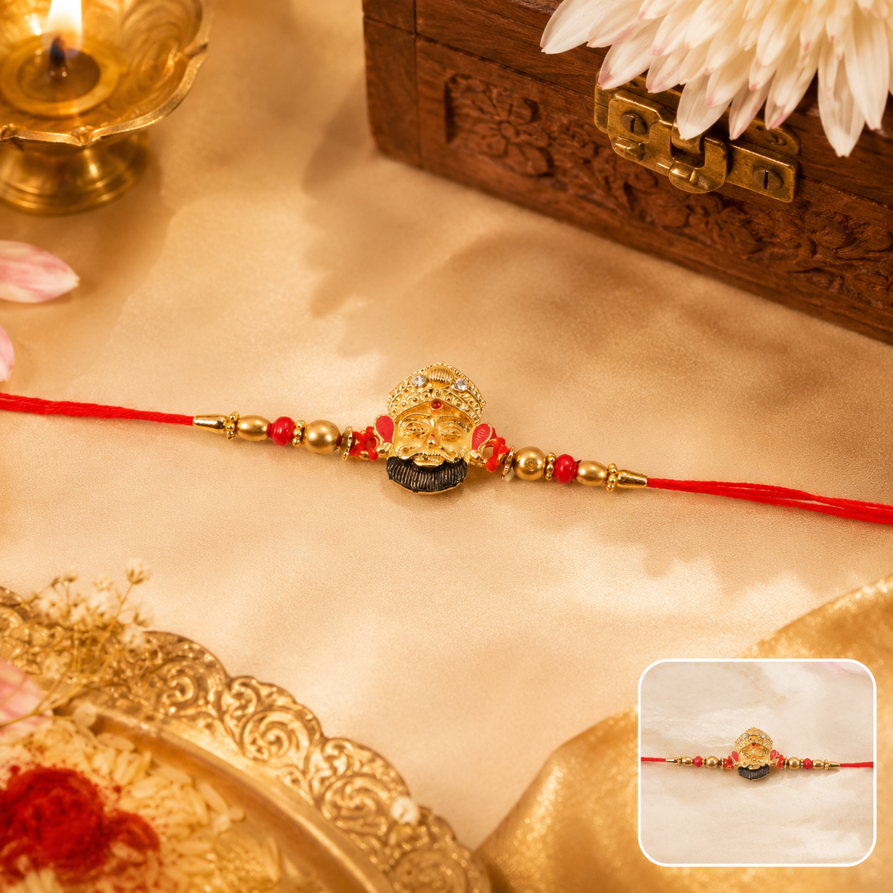 Front view of golden divine face charm rakhi with pearl beads