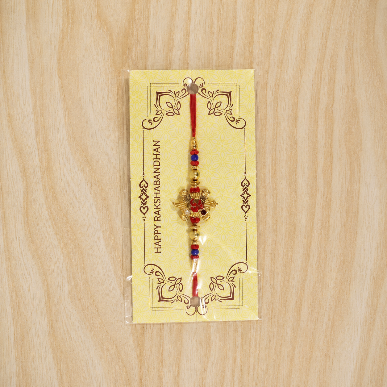 Full length of Golden Tortoise Om Meena beaded rakhi string
