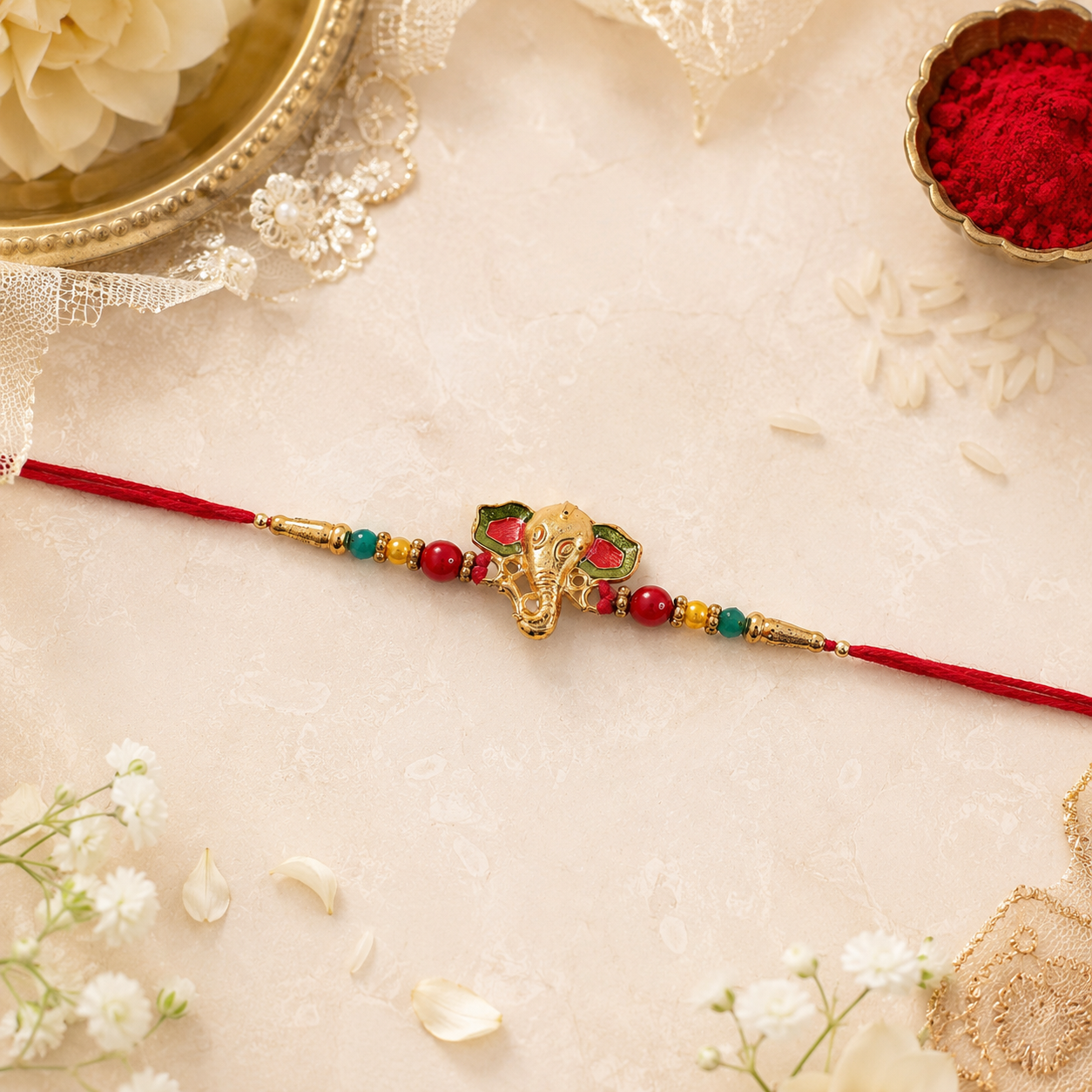 Close-up of golden Ganesha charm on multicolored beads rakhi