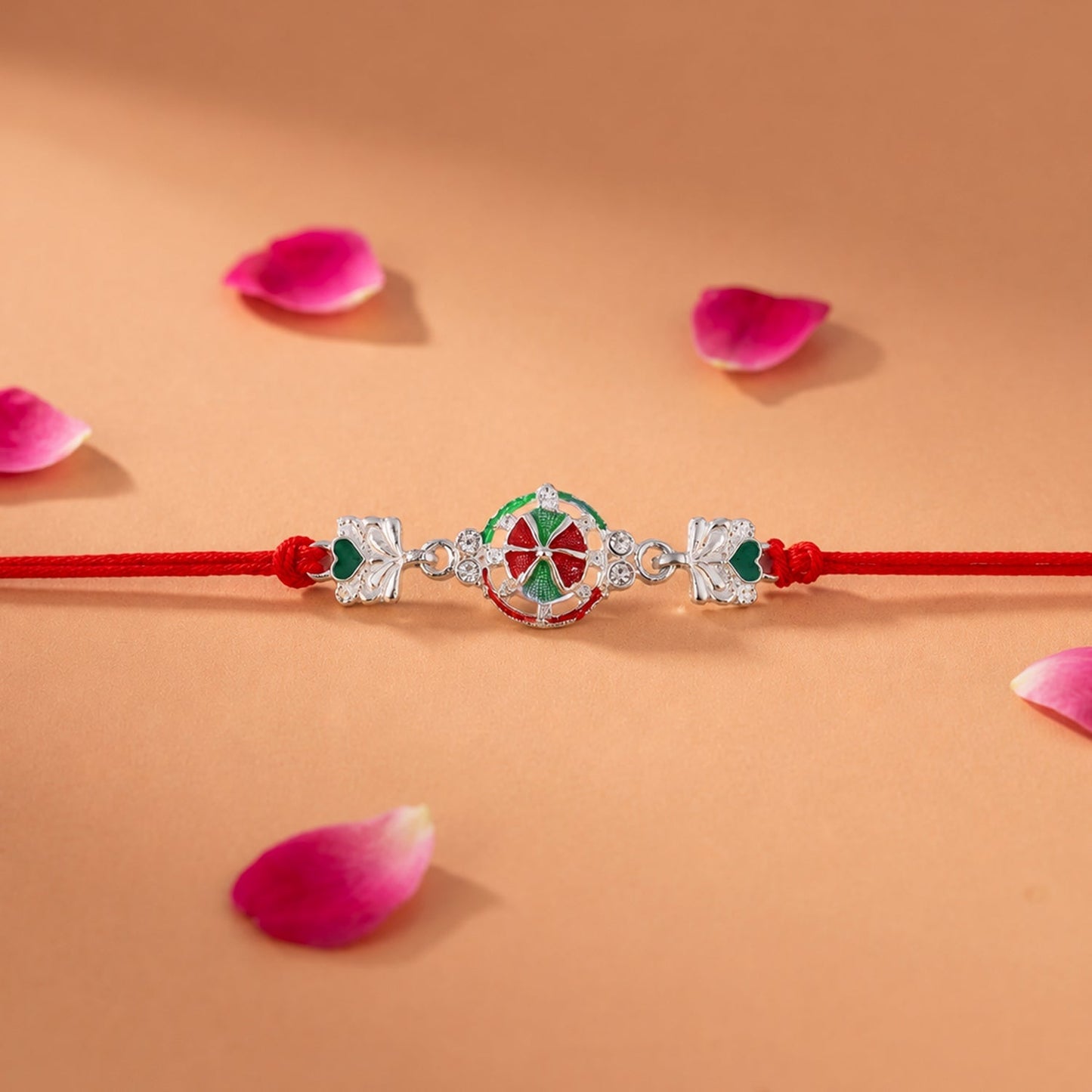 Silver designer rakhi tied with traditional dori