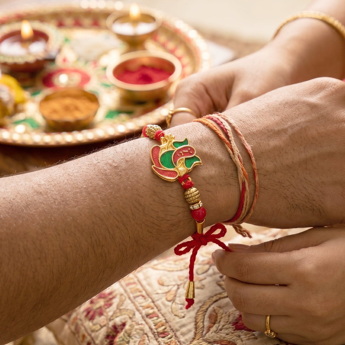 Elegant Lord Ganesha meenakari design for rakhi celebrating Raksha Bandhan