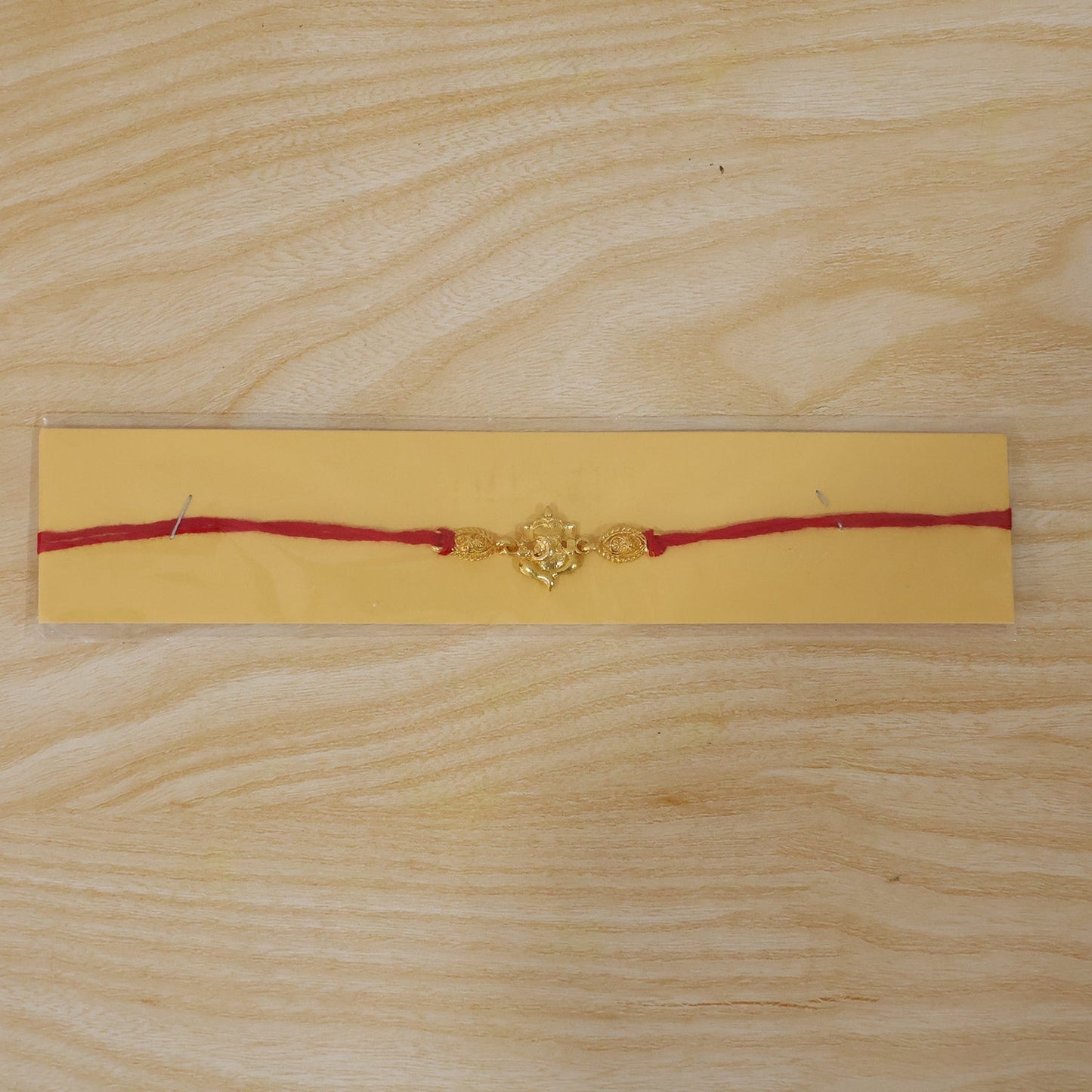 Multiple Twin Lord Ganesha Rakhis in a festive collection ready for Raksha Bandhan