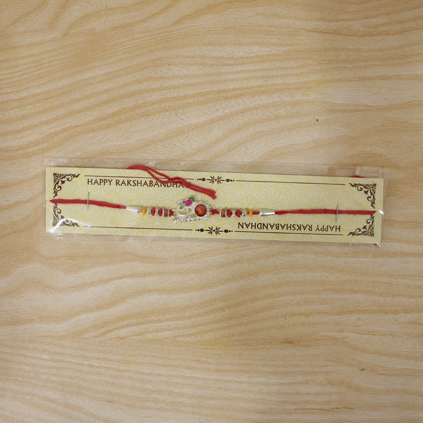 Beautiful multicolour Rakhi for children with traditional motifs