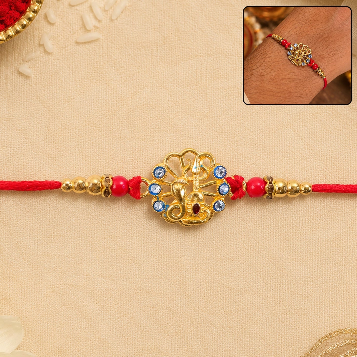 God Charm Rakhi with blue and red stones, perfect for Raksha Bandhan gift