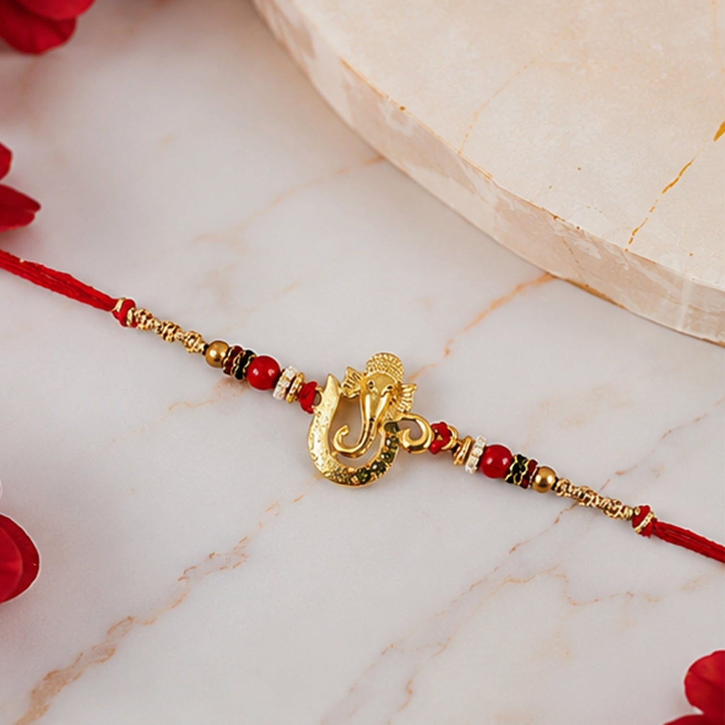 Elegant traditional rakhi for brothers, crafted with beads and gold accents