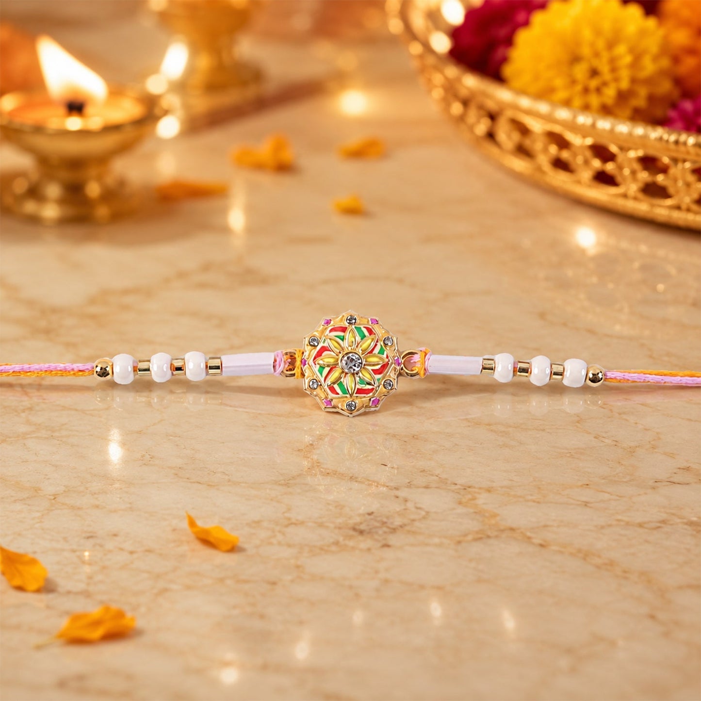Close-up of intricate Meenakari beadwork and pearl detailing on the Rakhi.