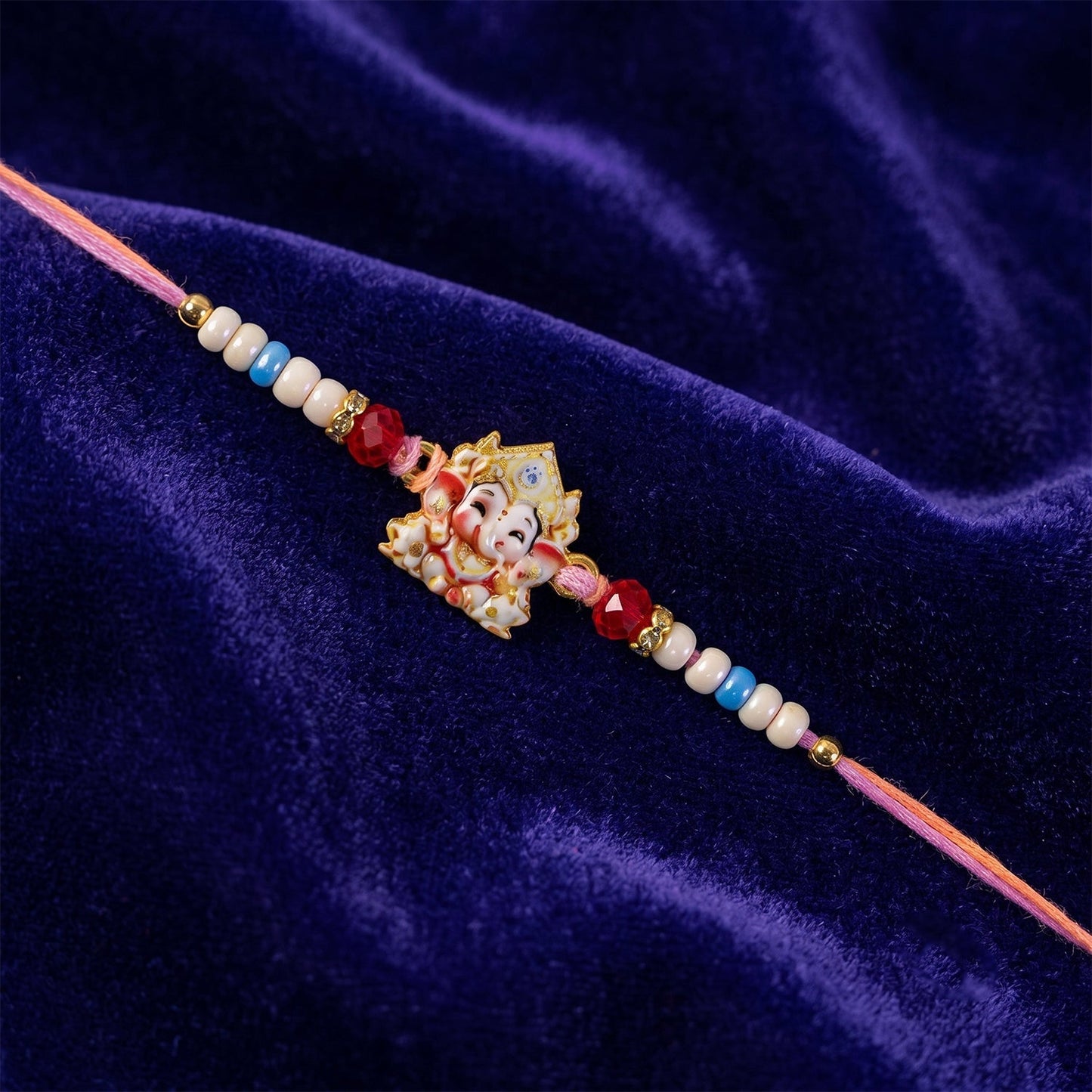Brother wearing a stylish Ganesha Rakhi on his wrist during Raksha Bandhan.