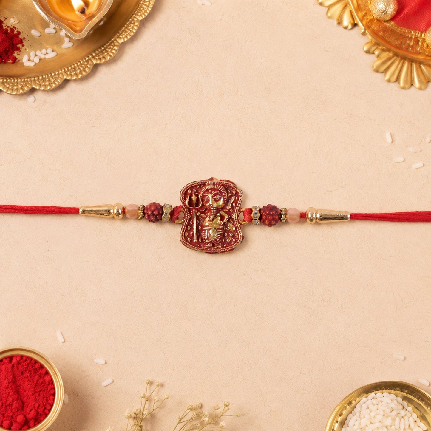 Another angle of the antique Ganesha Rakhi highlighting Rudraksha beads.