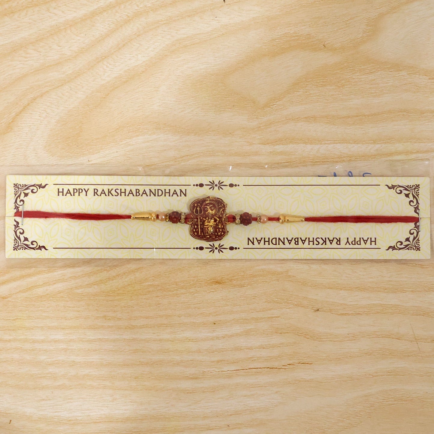 Complete spiritual design of the Ganesha Rudraksha Rakhi laid out.