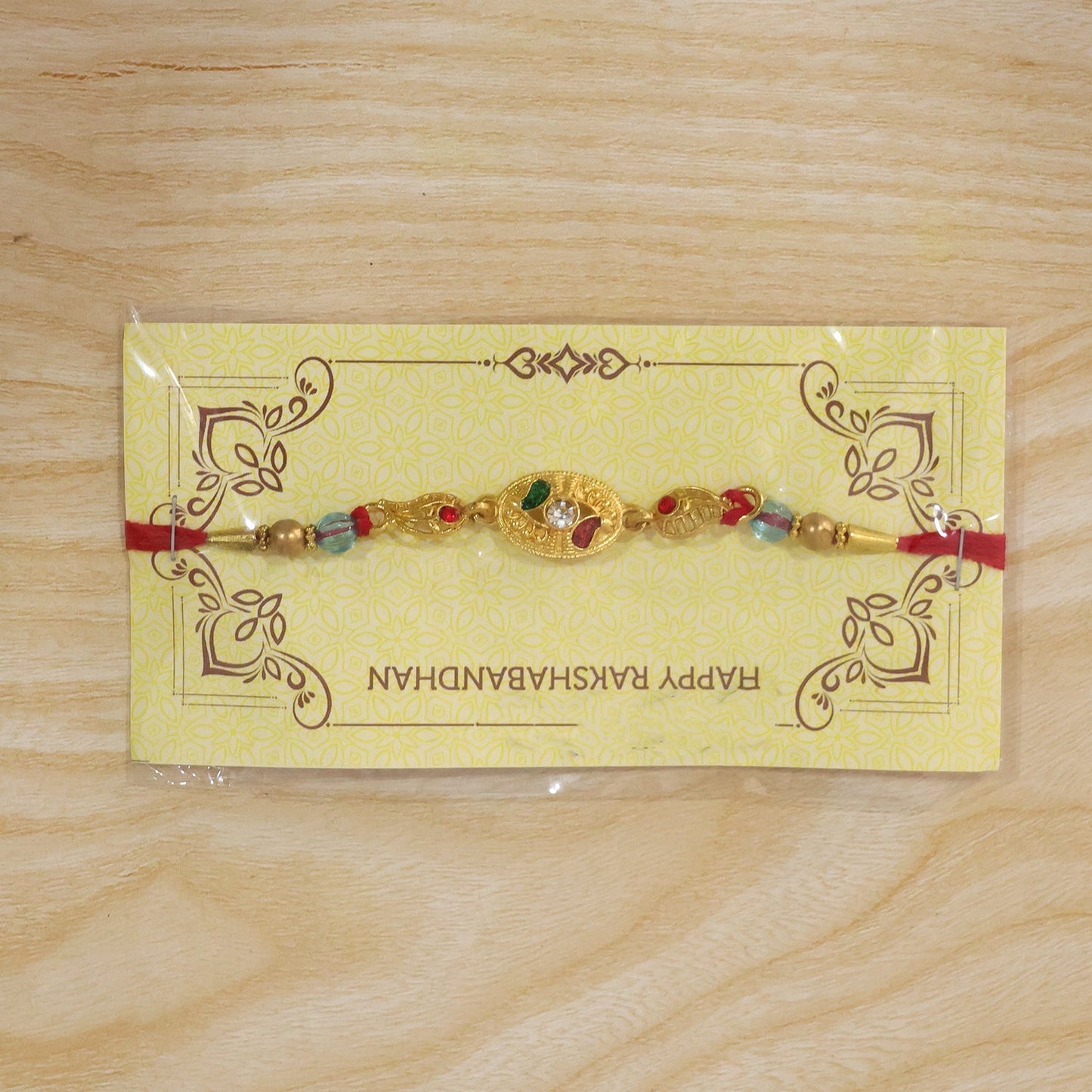 Overhead view of stylish AD Stone Rakhi, perfect for gifting.