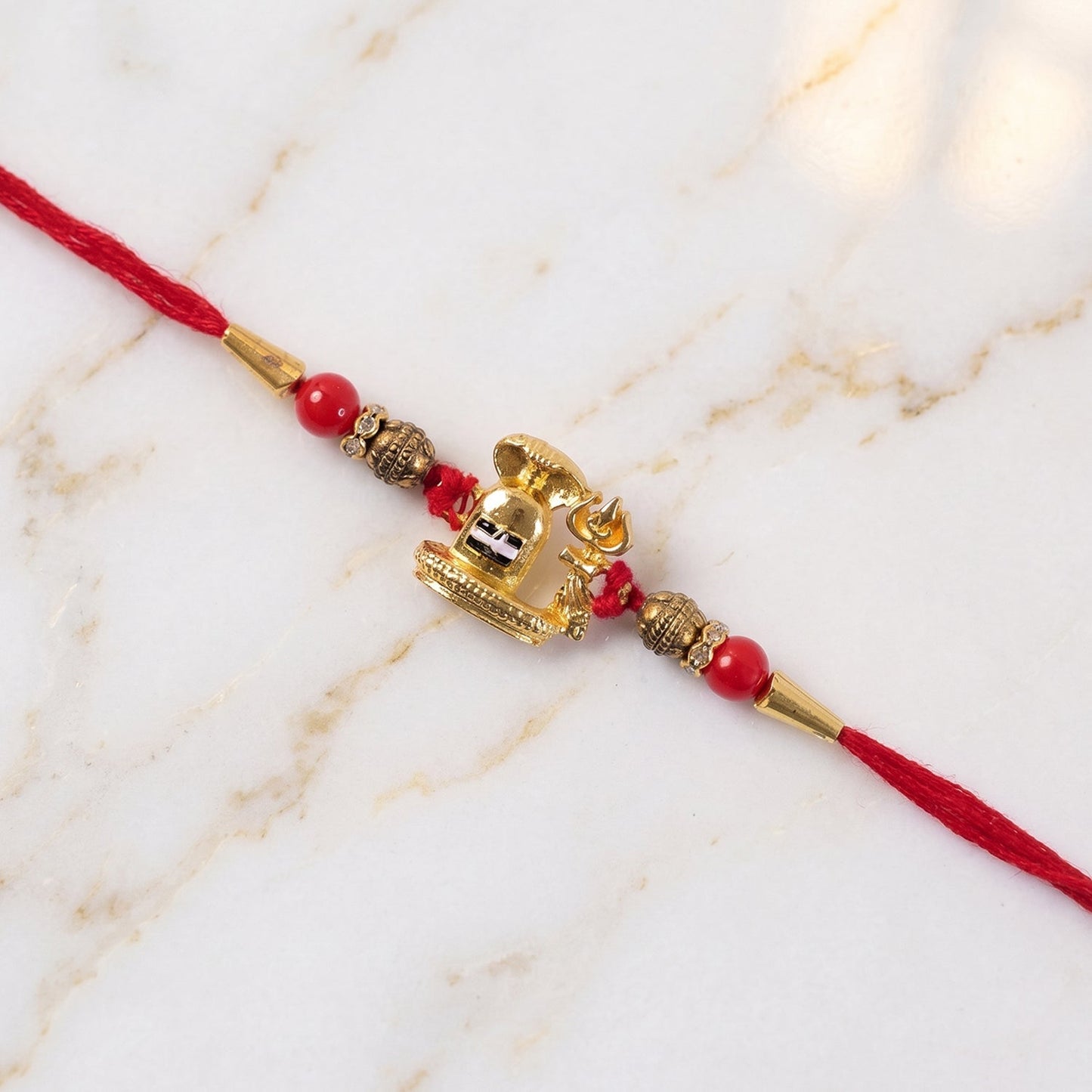 Full view of the beautifully crafted Shivling Rakhi, emphasizing its spiritual appeal.