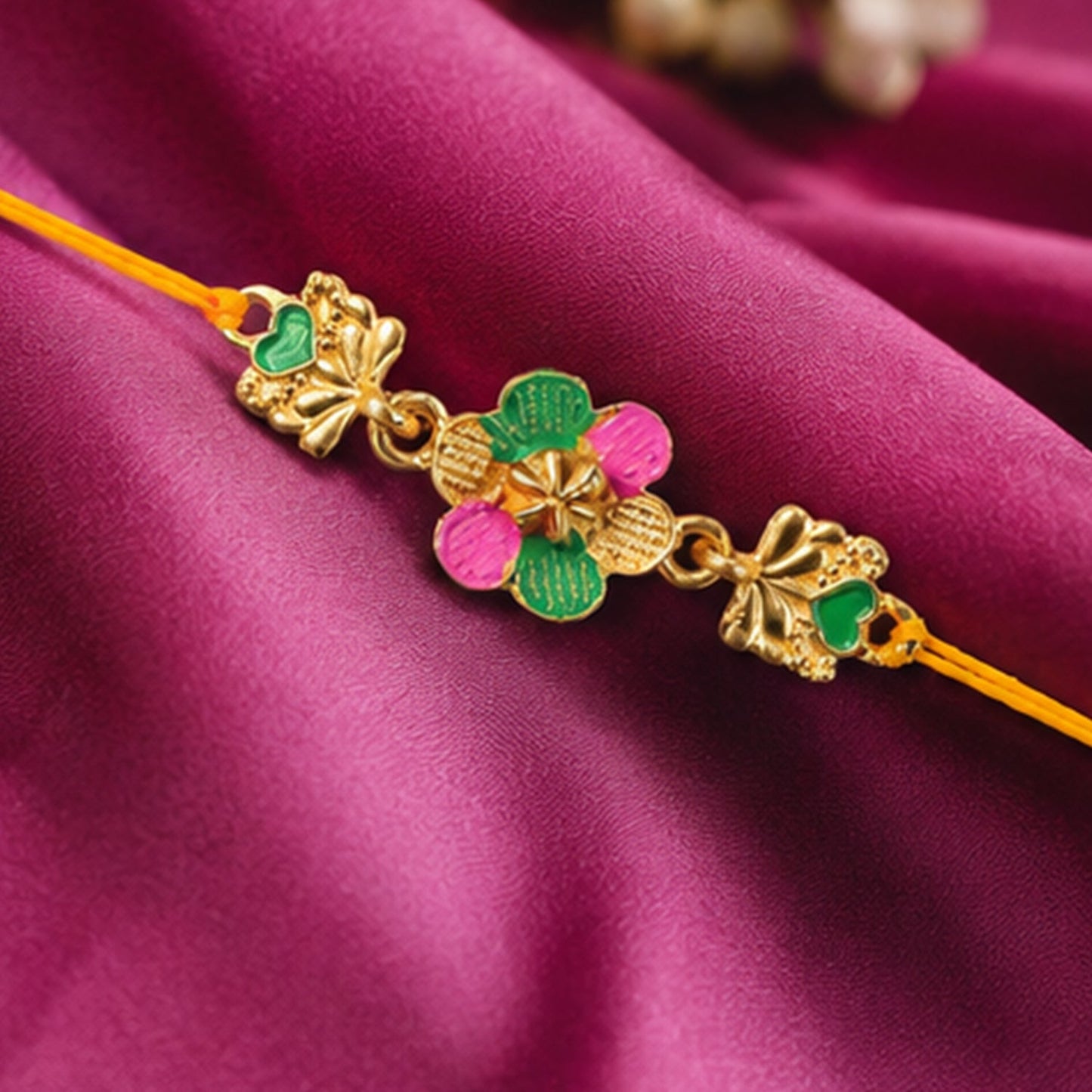 Side view of the Golden Meenakari Rakhi emphasizing traditional craftsmanship.