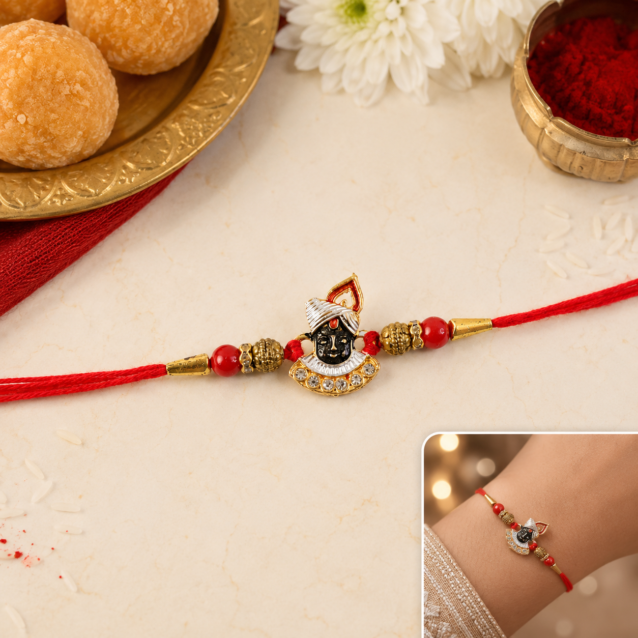 Close-up of the Rakhi for Brother with intricate AD stones and red beads.