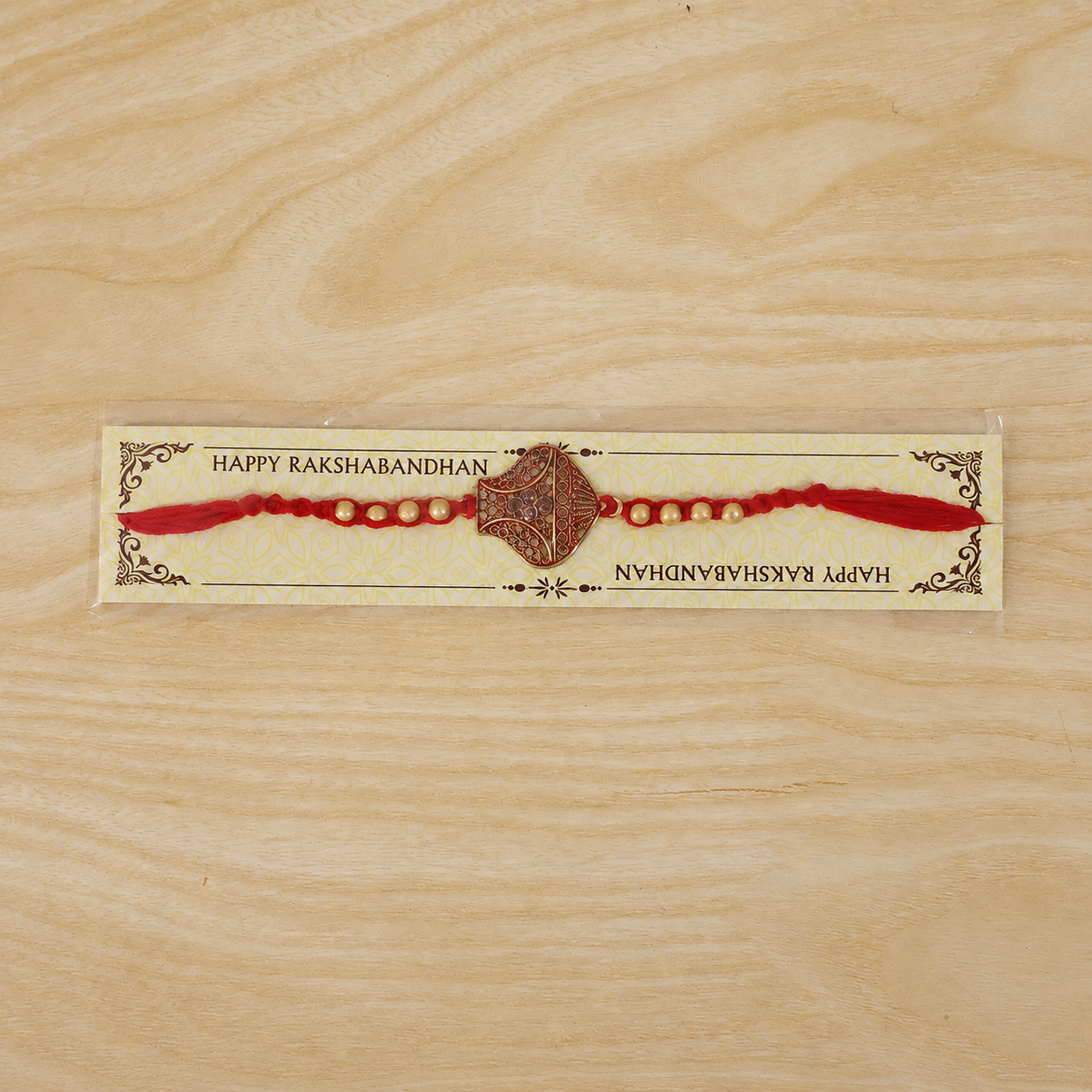 Golden bead detail on unique Rakhi for brother.
