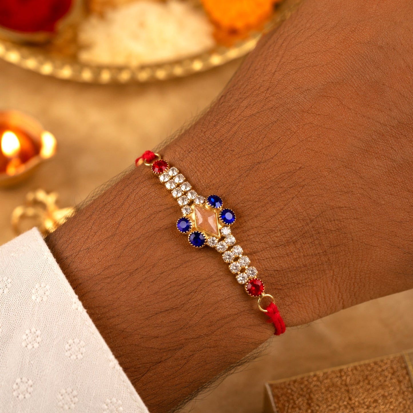 Close-up of sparkling AD stones on the designer Rakhi.