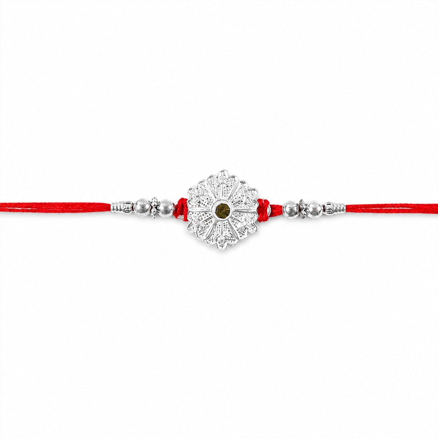Elegant and lightweight silver rakhi with green stones for Raksha Bandhan celebrations