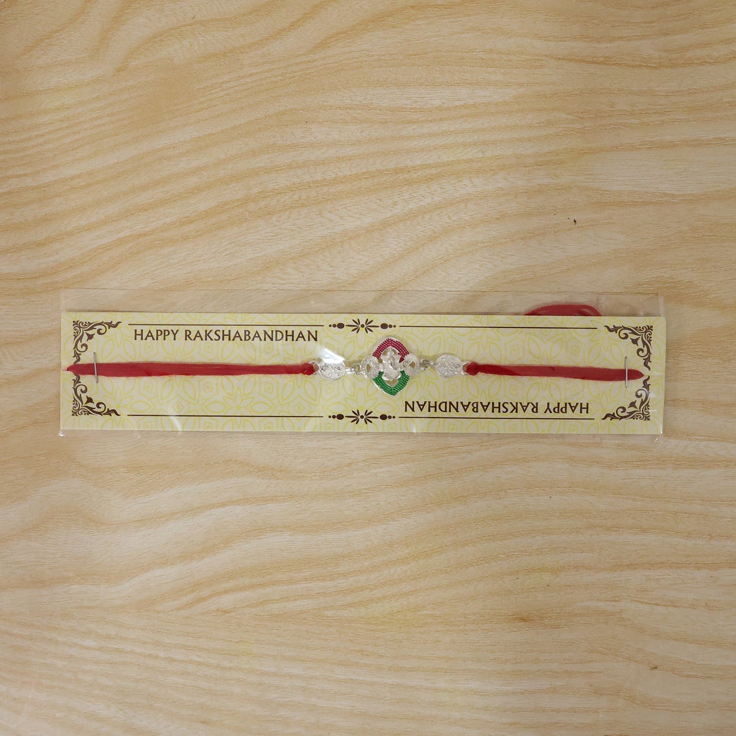 Front view of the traditional Ganesha Meenakari Rakhi for siblings.
