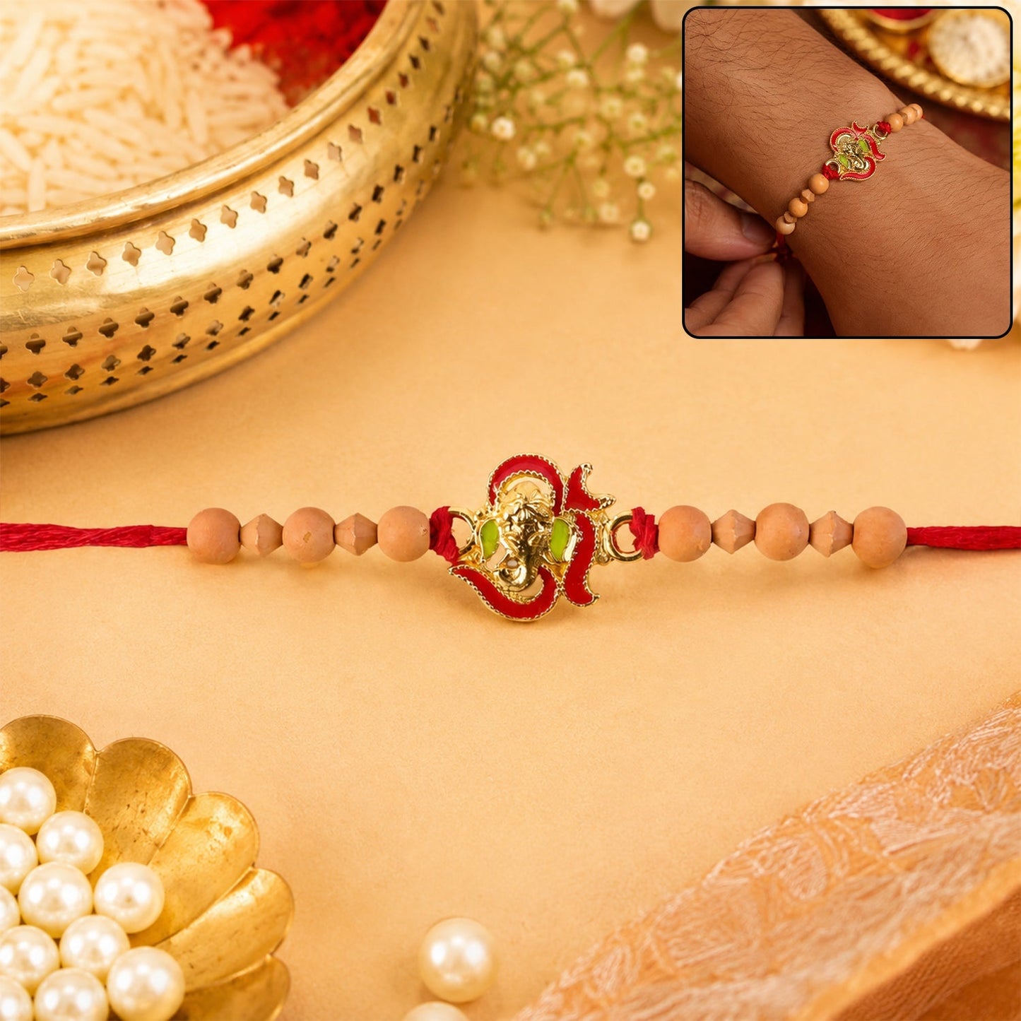 Close-up of Lord Ganesha Rakhi with natural sandalwood beads.