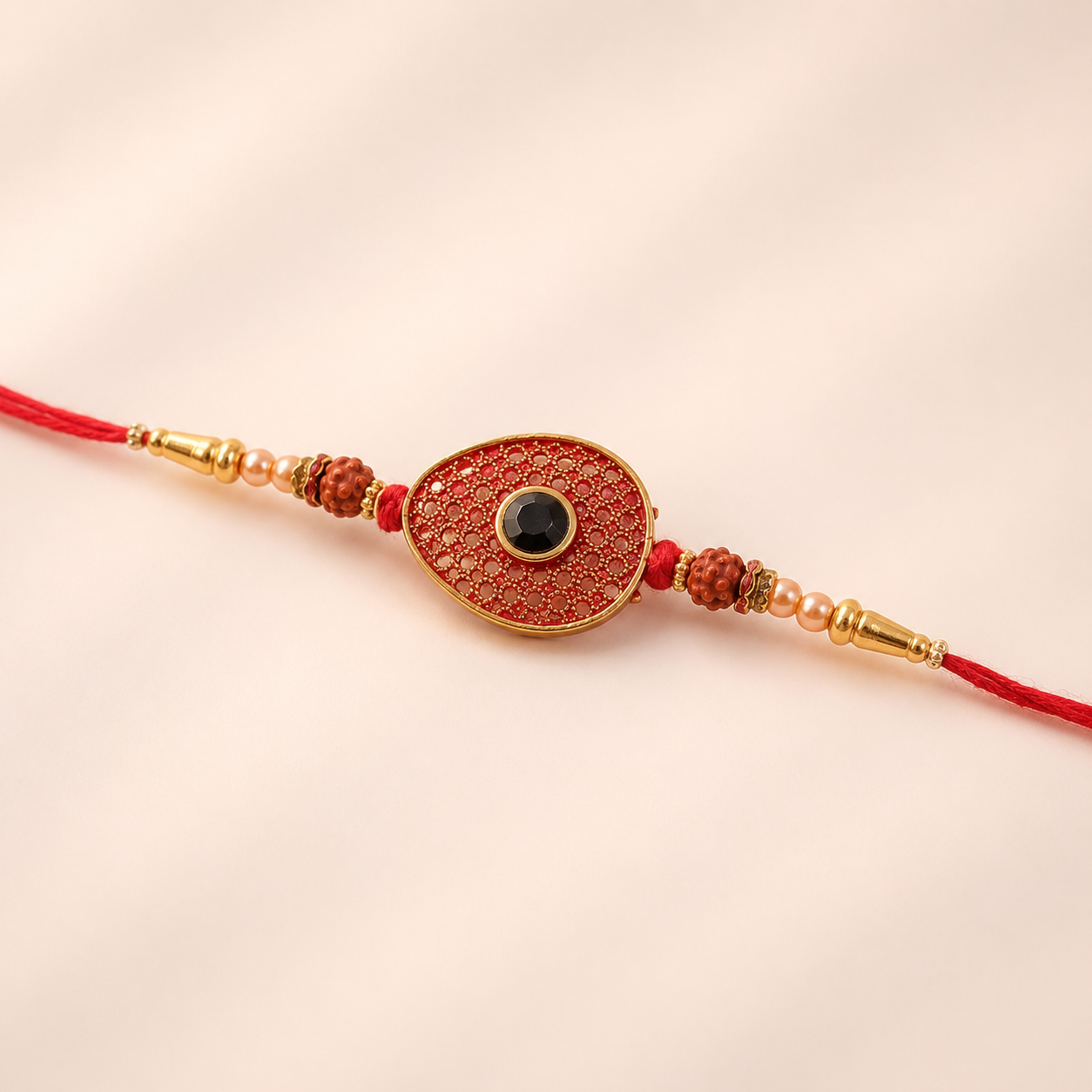 Red meenakari oval disc designer Rakhi with decorative beads for Raksha Bandhan