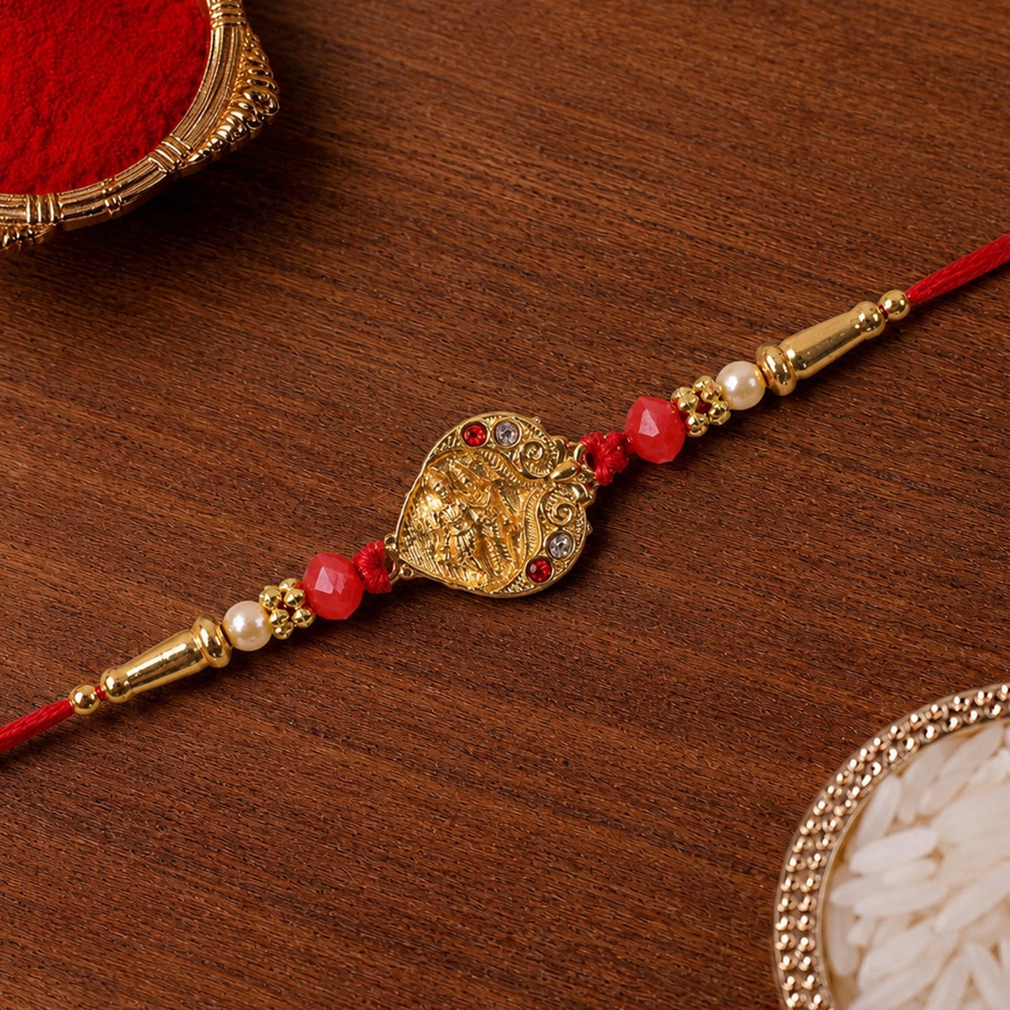Close-up of a beautifully crafted decorative rakhi with beads and thread.