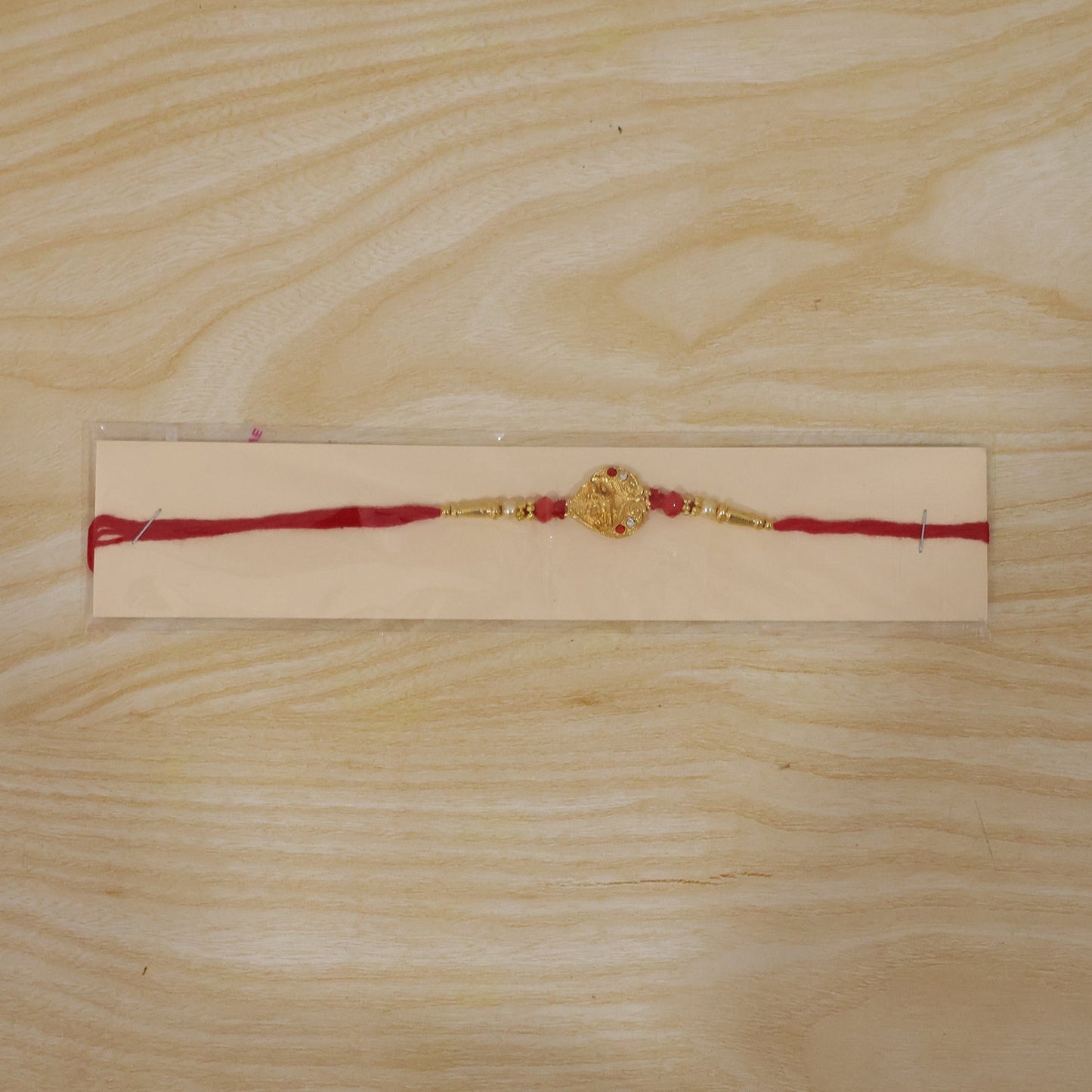 Festive rakhi with beautiful center design, perfect for Raksha Bandhan.