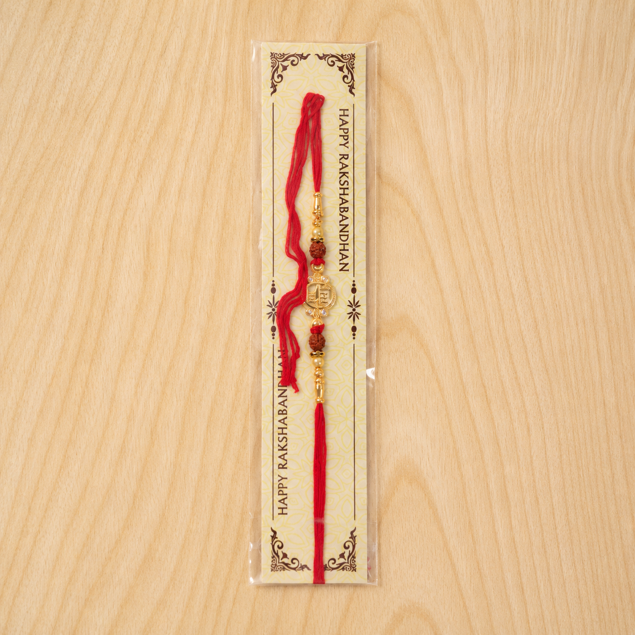 Details of intricate thread work and decorative elements on the Rakhi.