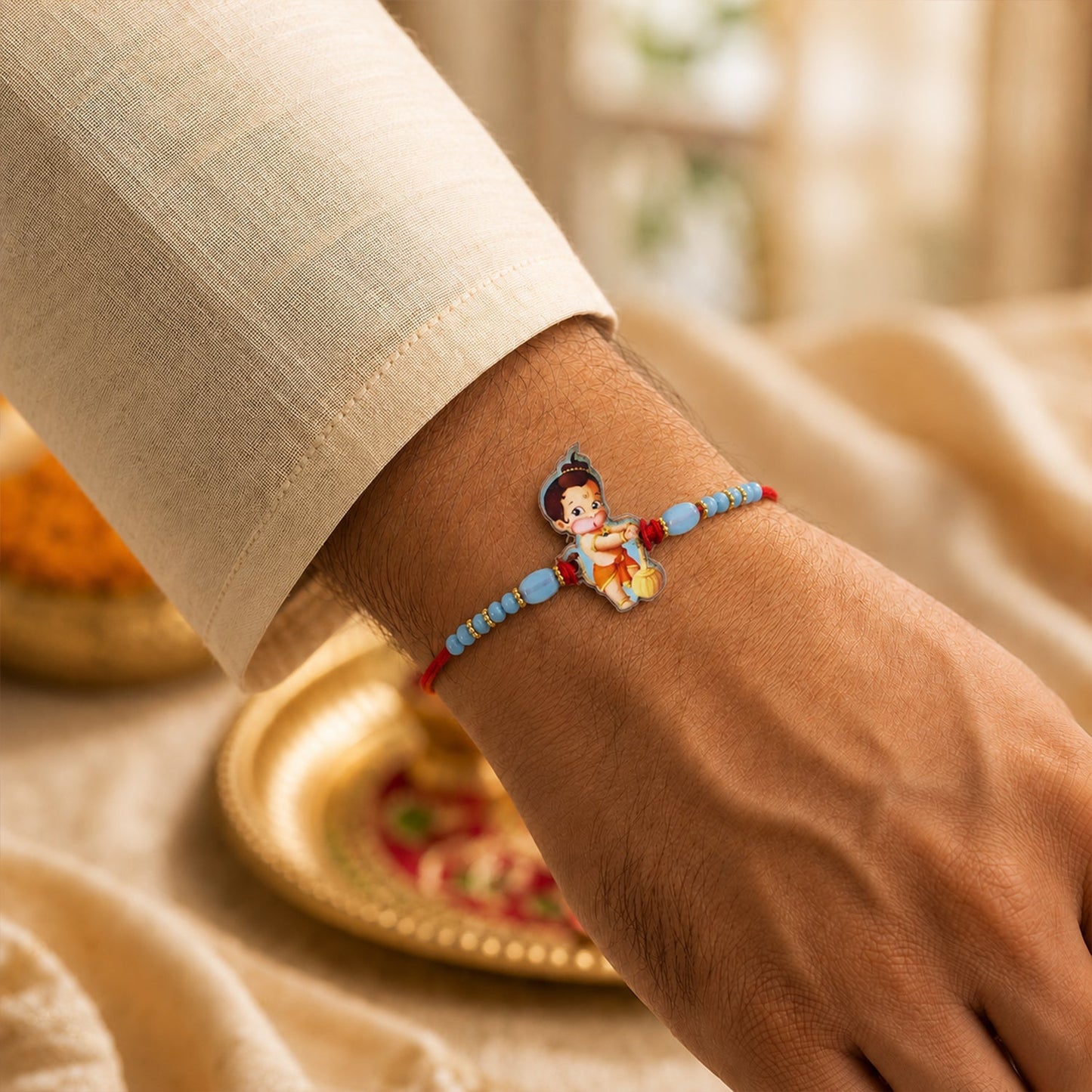 Decorative Bal Hanuman themed rakhi with beads and thread detailing