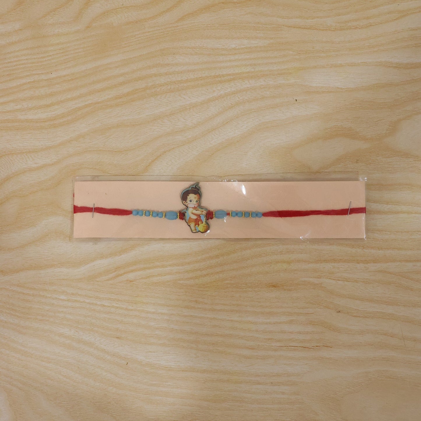 Beautifully crafted Bal Hanuman rakhi with beads and festive appeal