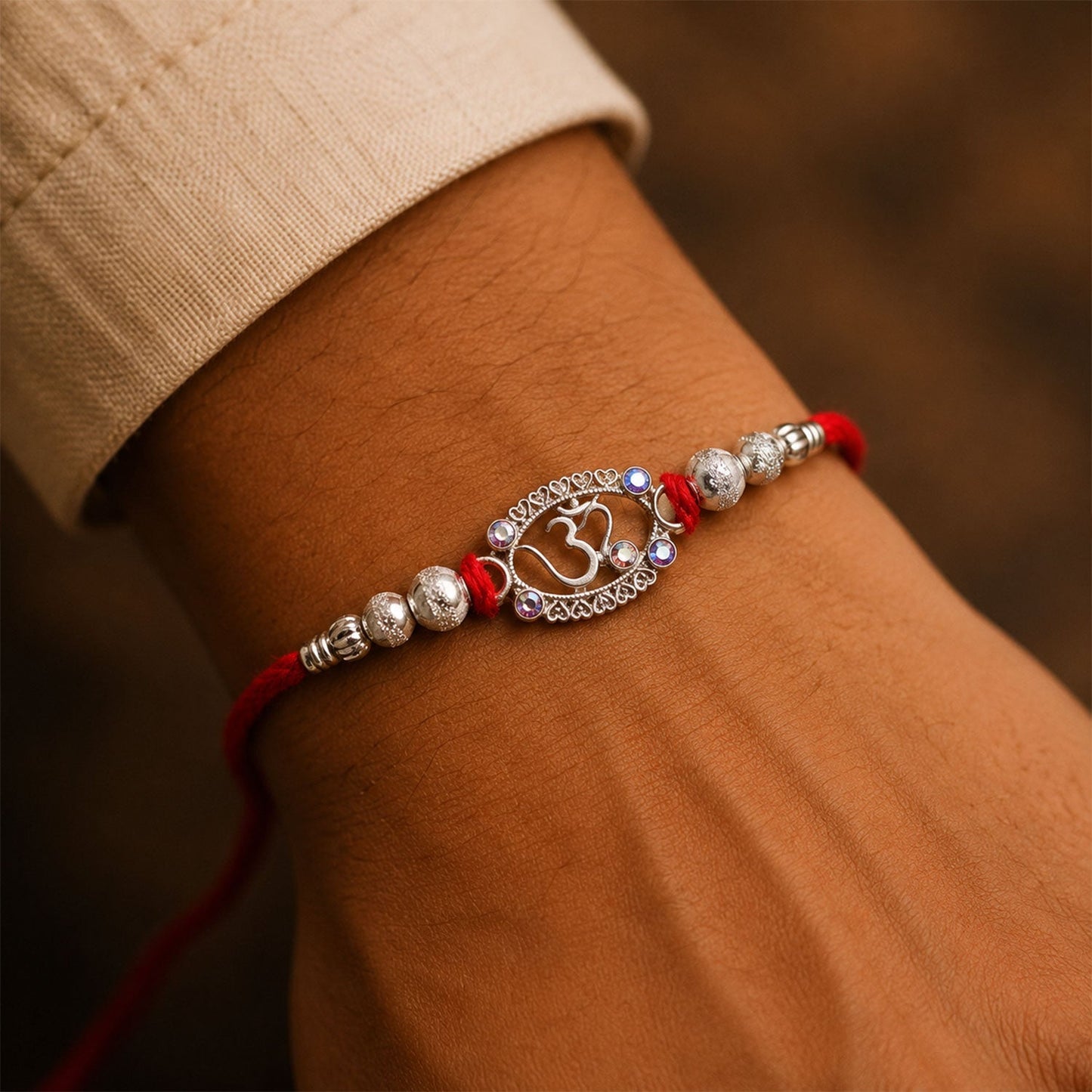 Oxidised silver Om Rakhi with decorative beads and traditional design