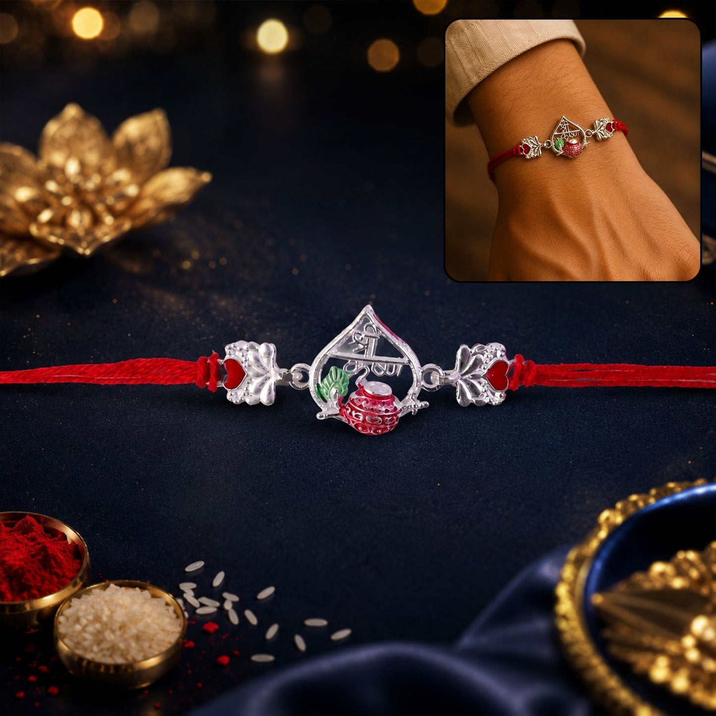 Close-up of a traditional silver peacock meenakari rakhi with red and green accents