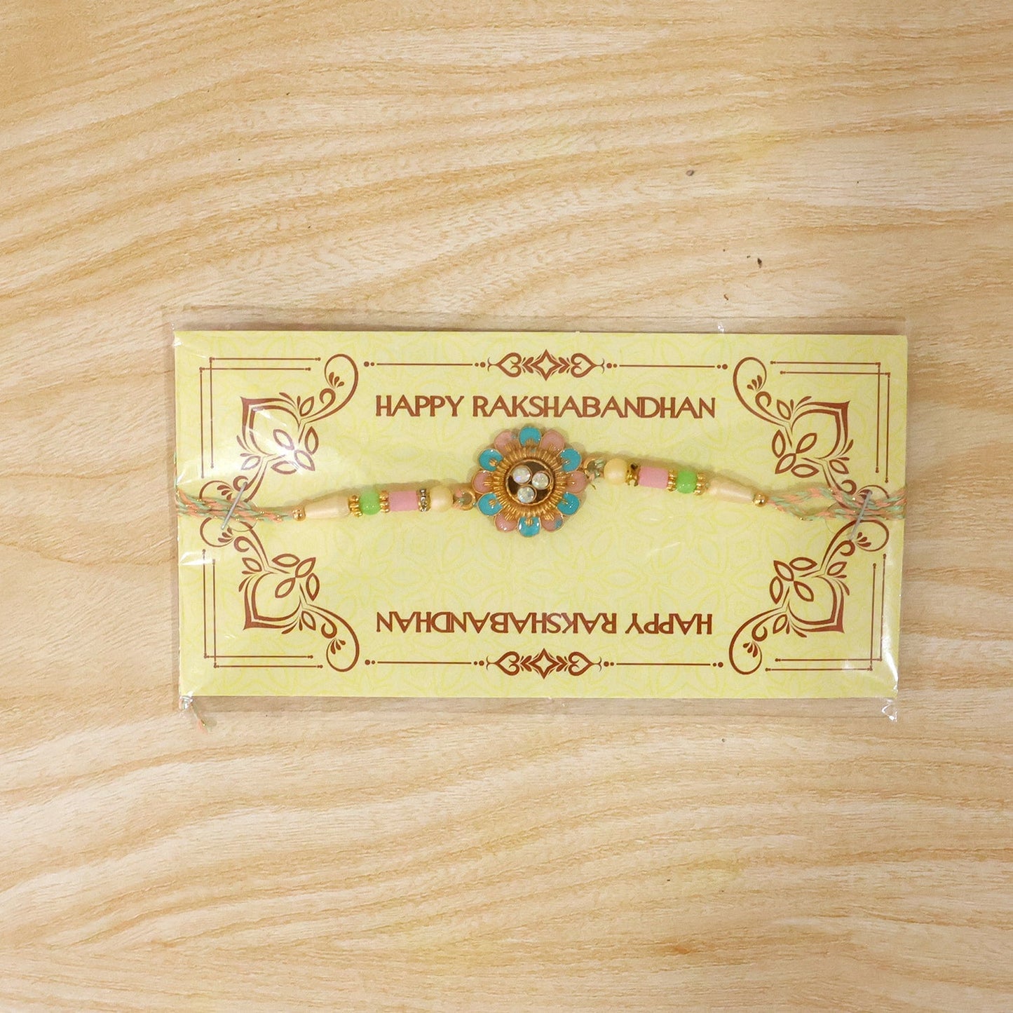Festive Blue Pink Meenakari floral Rakhi with intricate details