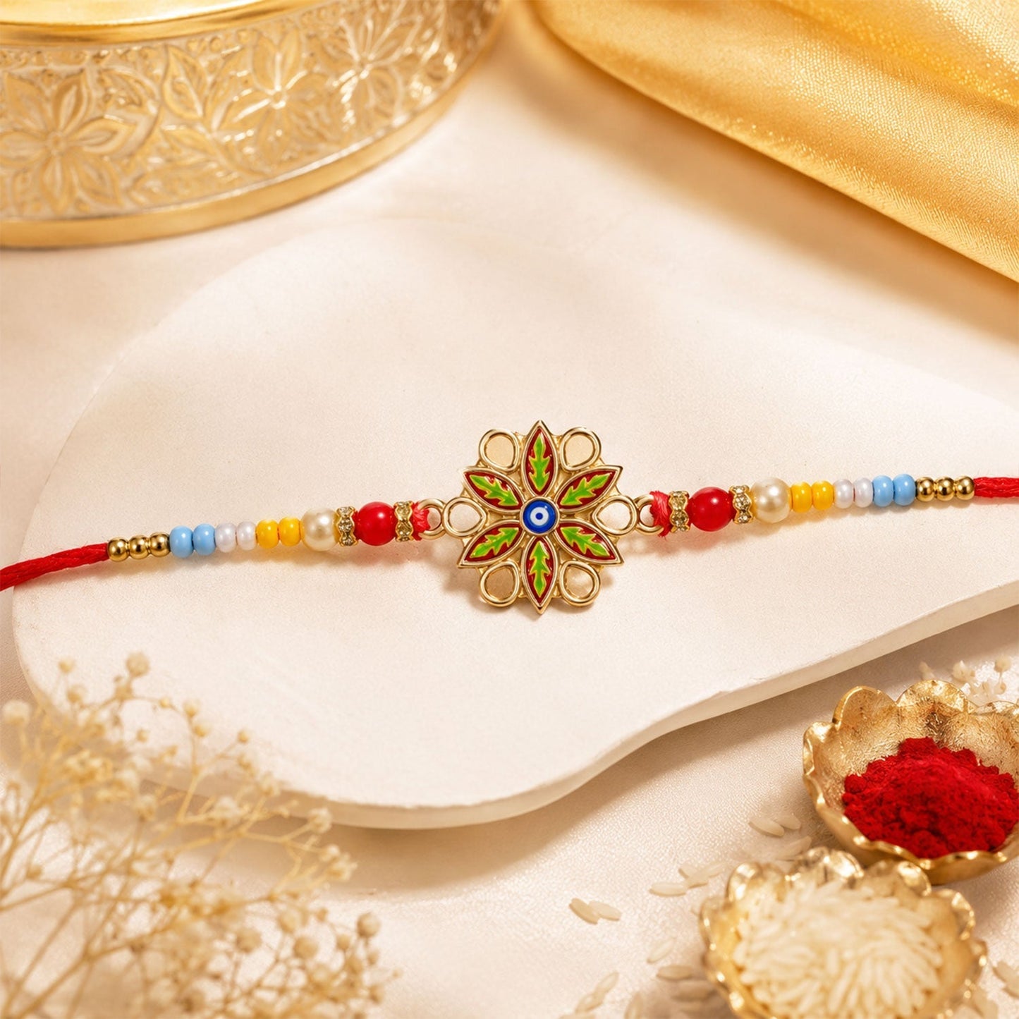Ready to be tied Golden Meenakari Rakhi for brother, perfect for Rakshabandhan.