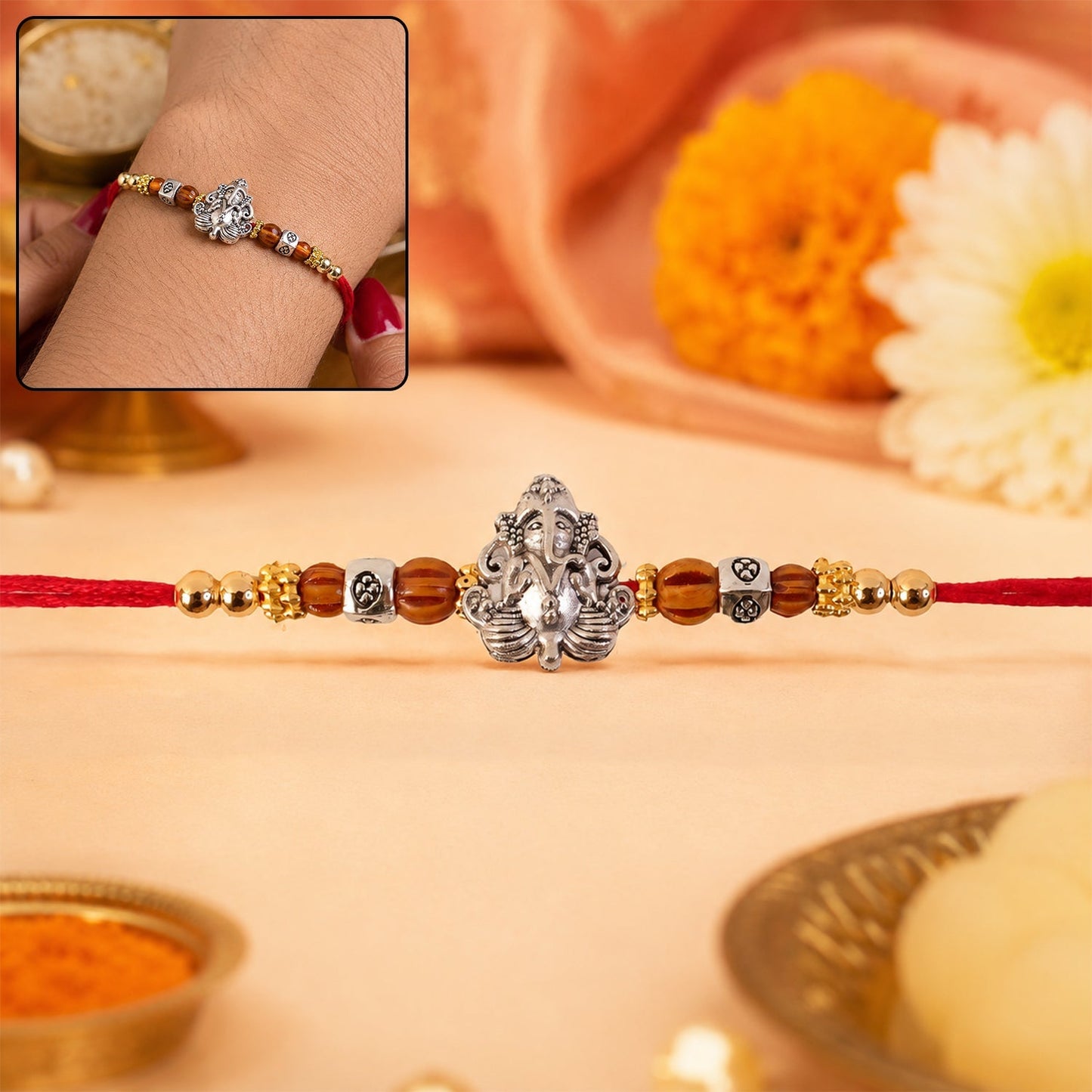 Elegant Silver Lord Ganesha Rakhi with Rudraksha beads for Raksha Bandhan