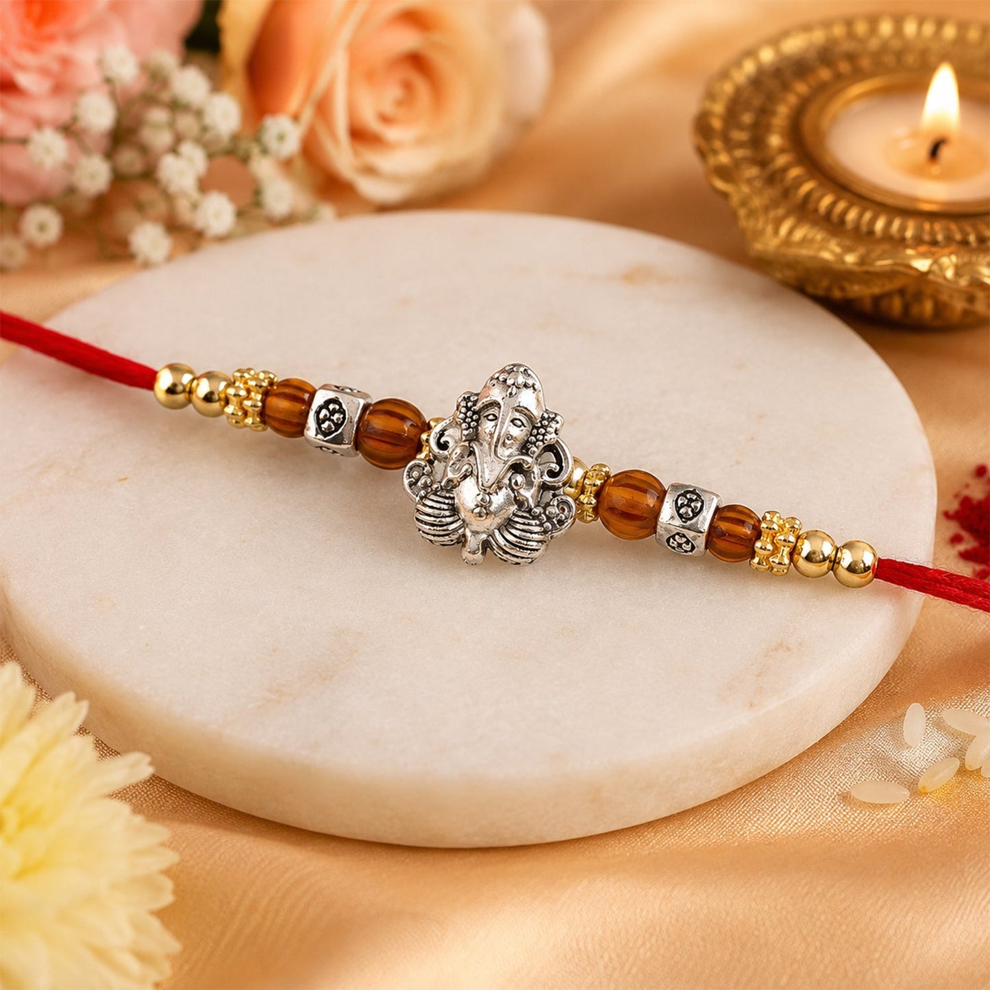 Traditional Ganesha-themed Rakhi with Rudraksha for Raksha Bandhan