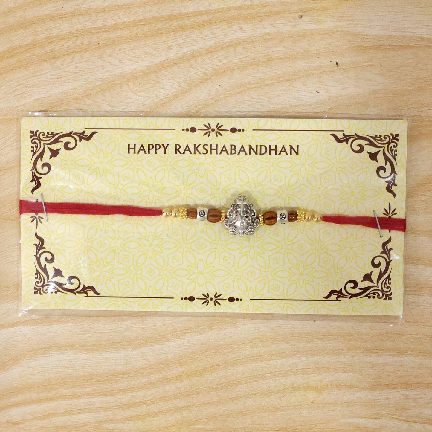 Premium Ganesha Rakhi with Rudraksha, suitable for festival gifts