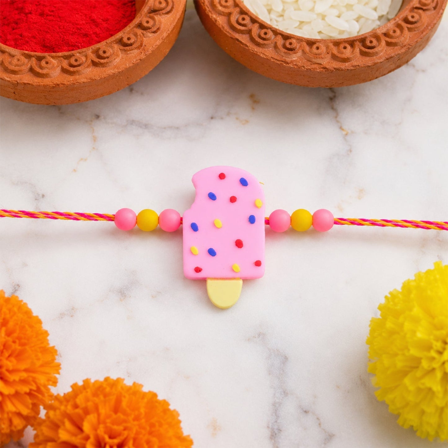 Child wearing the colourful Ice Cream Kids Rakhi celebrating sibling love.