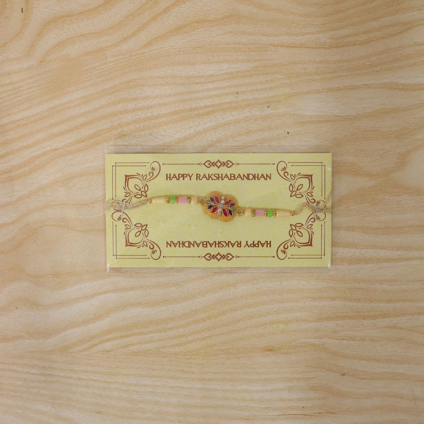 Beautifully crafted meenakari floral rakhi with elegant design elements