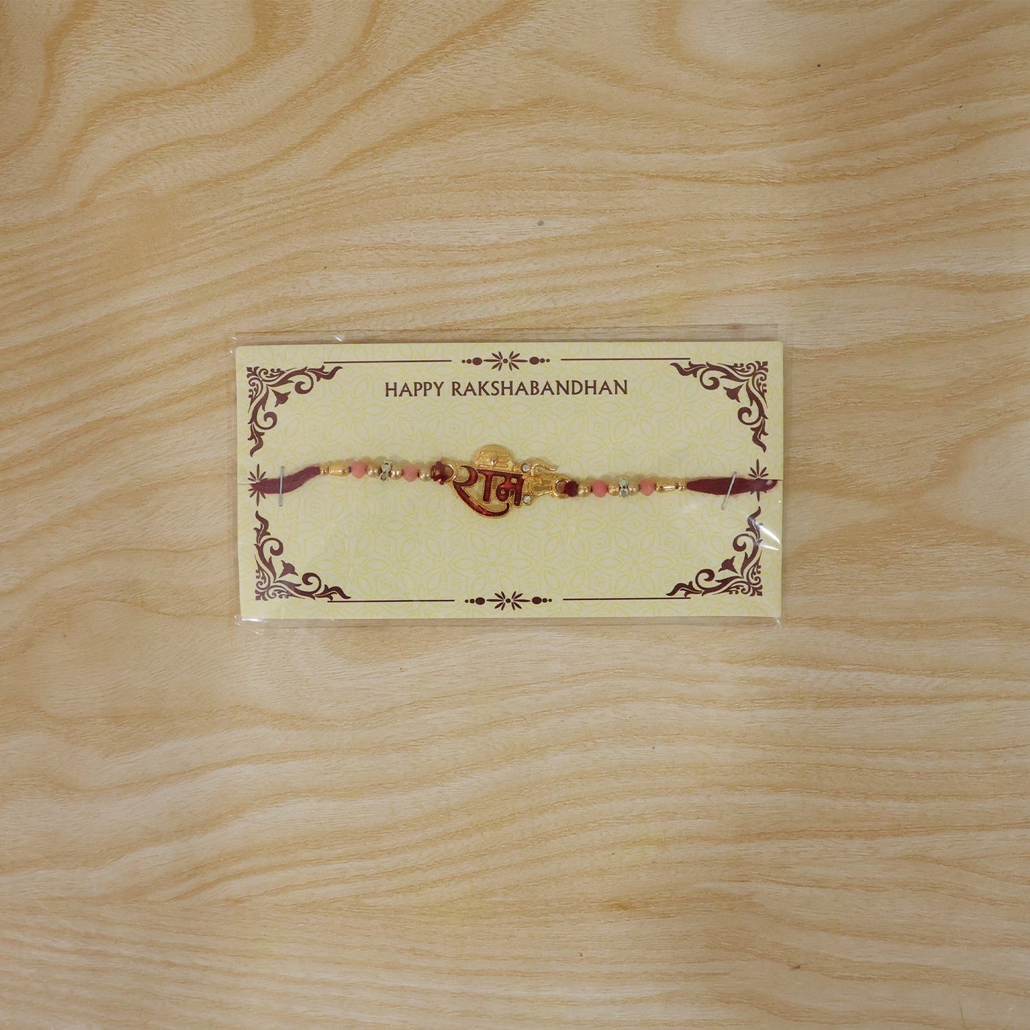 Beautifully crafted Golden Ram Rakhi with durable thread and vibrant design
