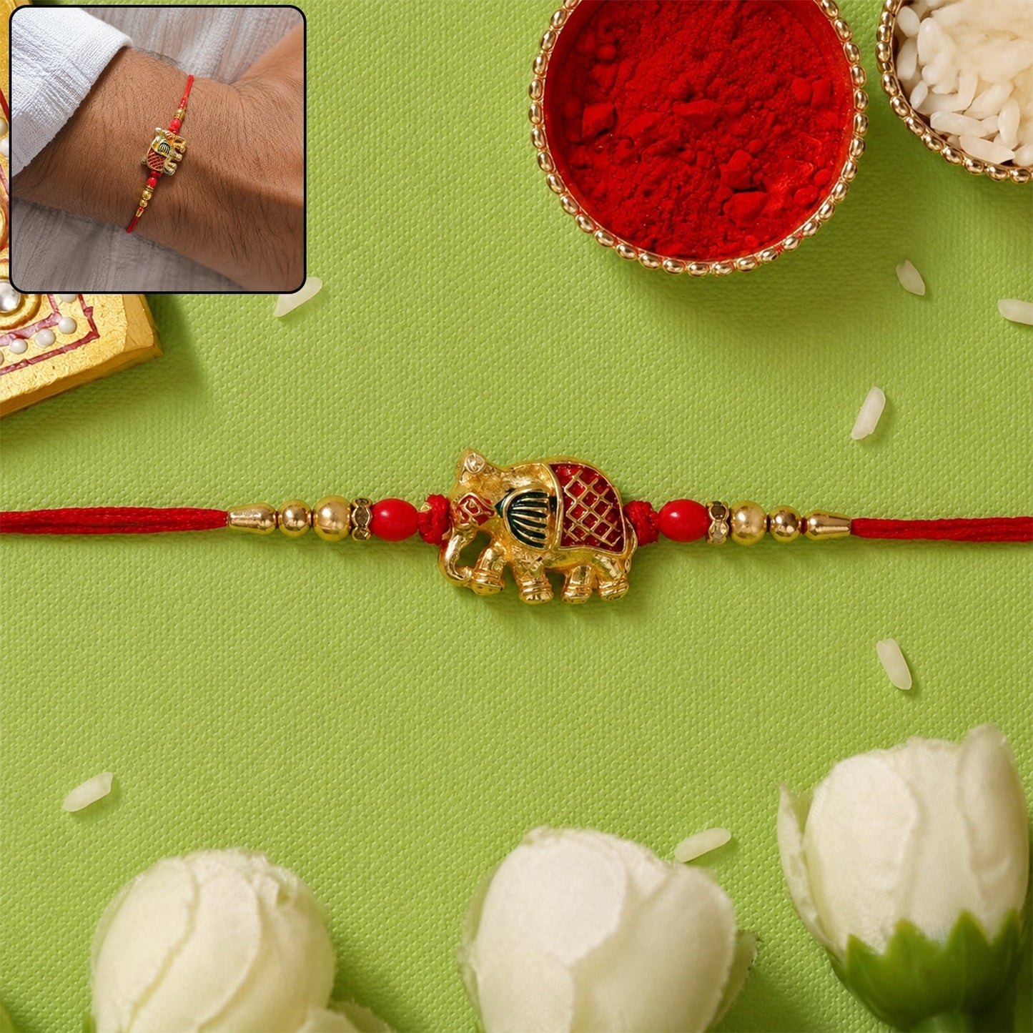 Front view of Gold Elephant Charm Rakhi with beads and red thread