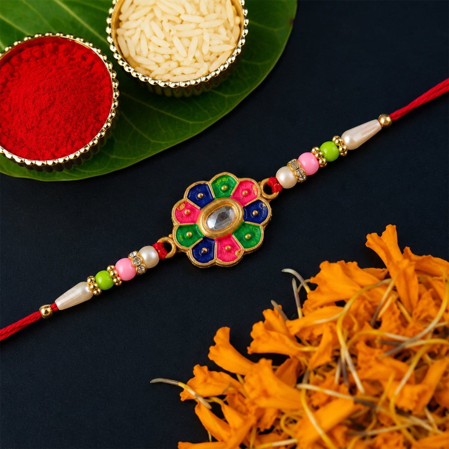 Side view of floral stone rakhi with decorative beads