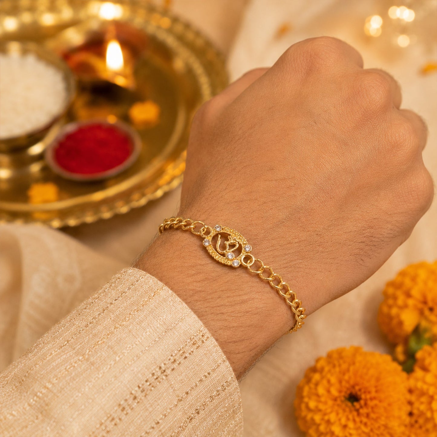 Hand wearing Om stone studded rakhi bracelet for festival