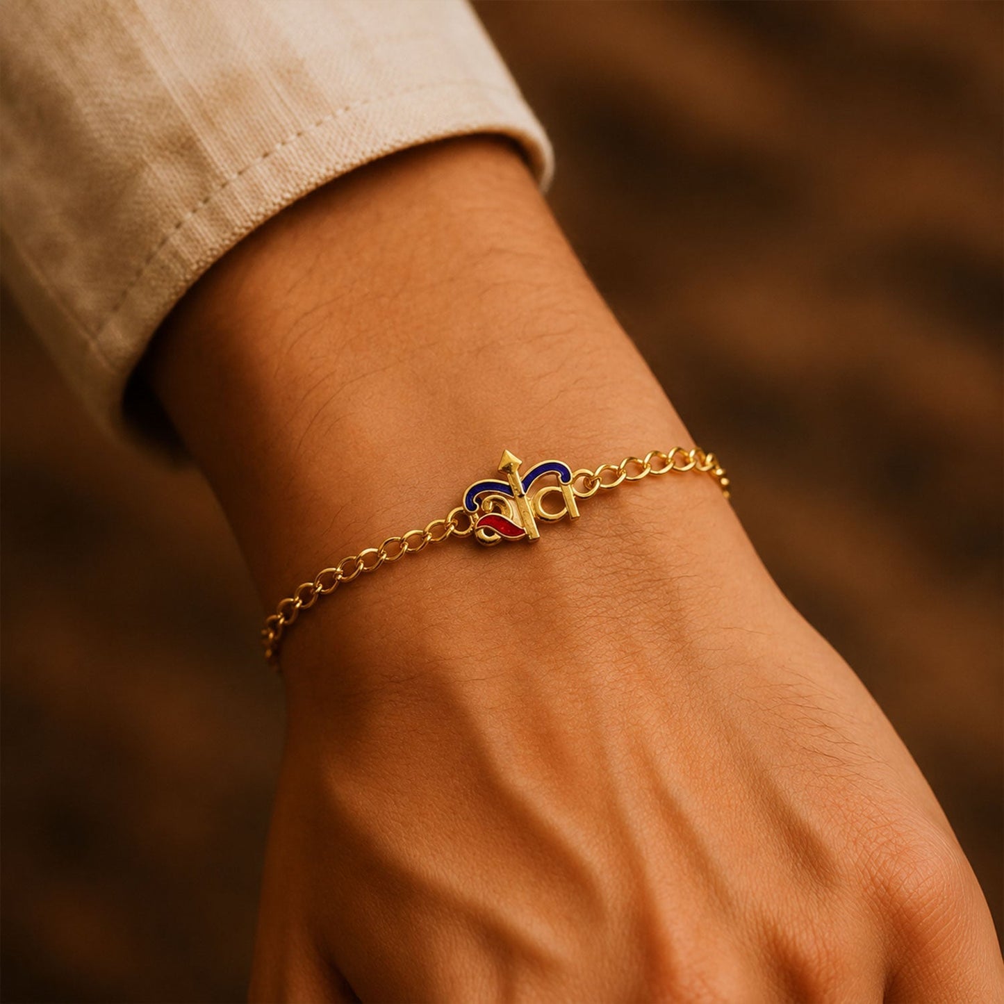 Closeup of decorative beads on gold tone bracelet rakhi
