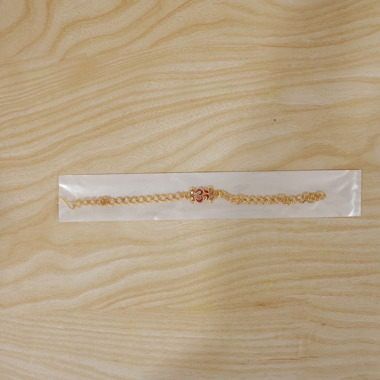 Detailed finishing Om Rakhi with traditional elements