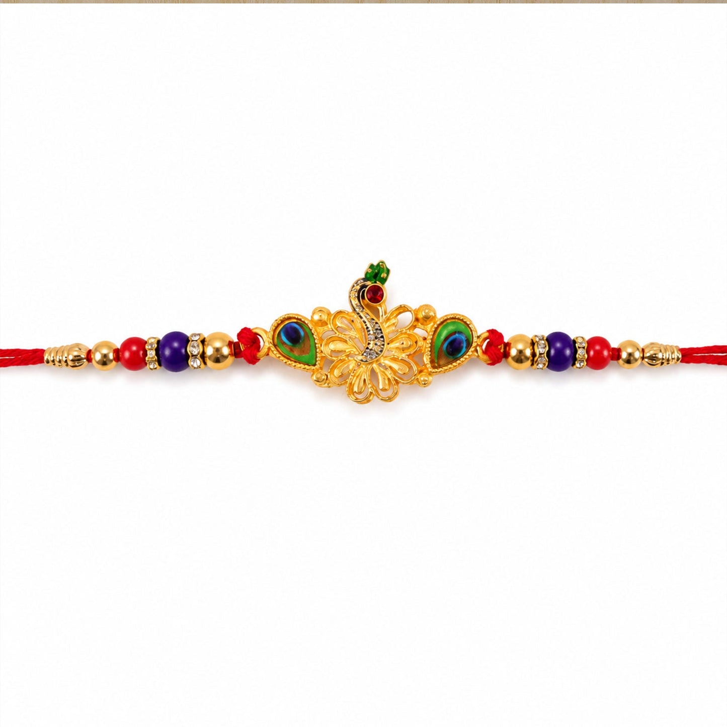 Beautiful Peacock Rakhi with multicolor stones and traditional appeal.