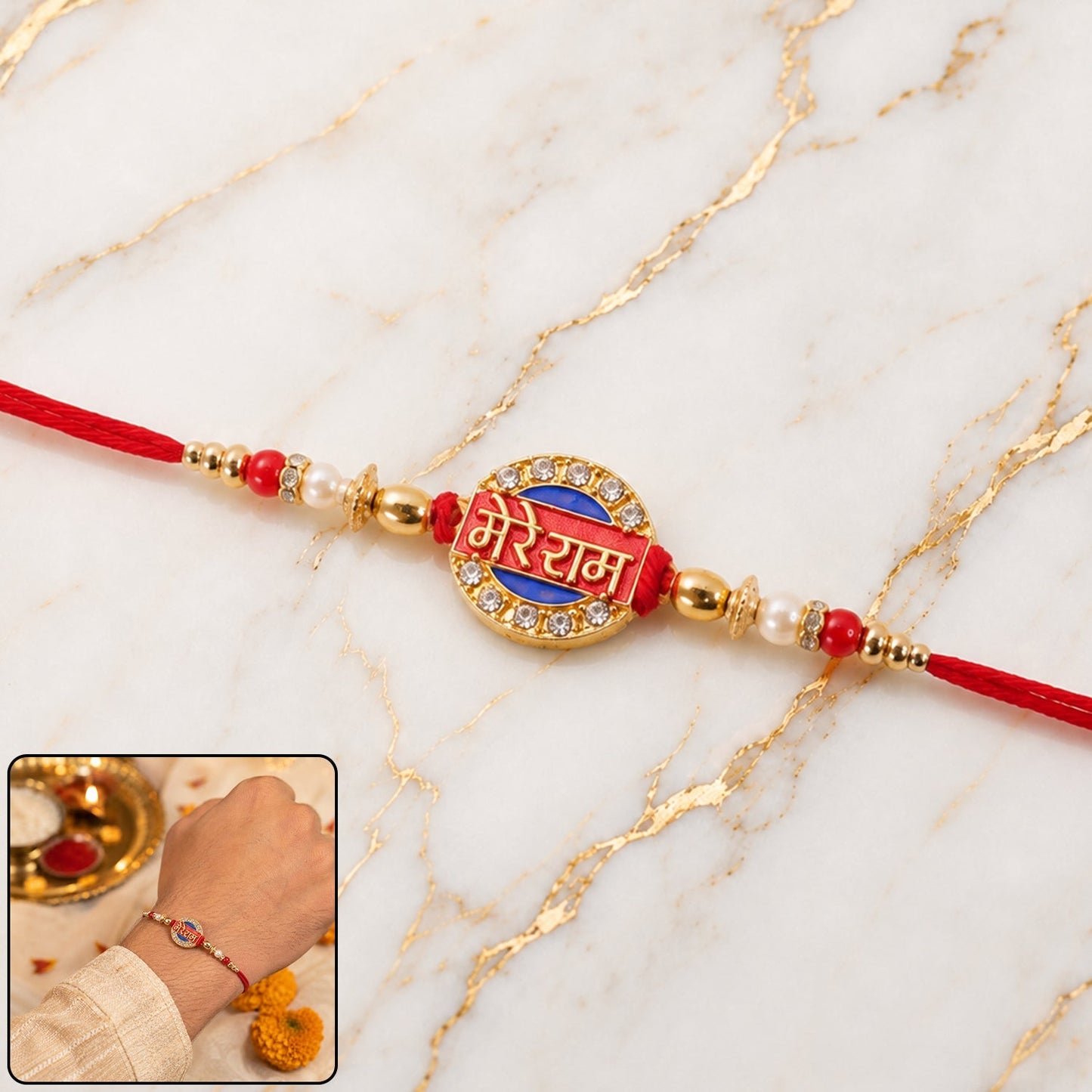 Red enamel Rakhi with gold-tone decorations, perfect for Rakshabandhan festival